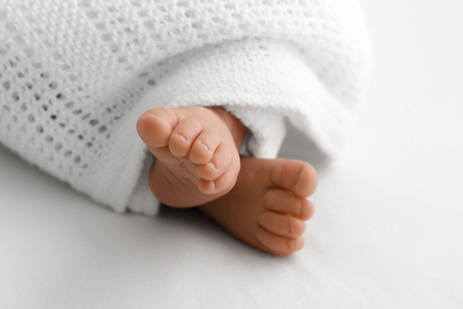 Close up of newborn baby toes during lifestyle newborn photography session