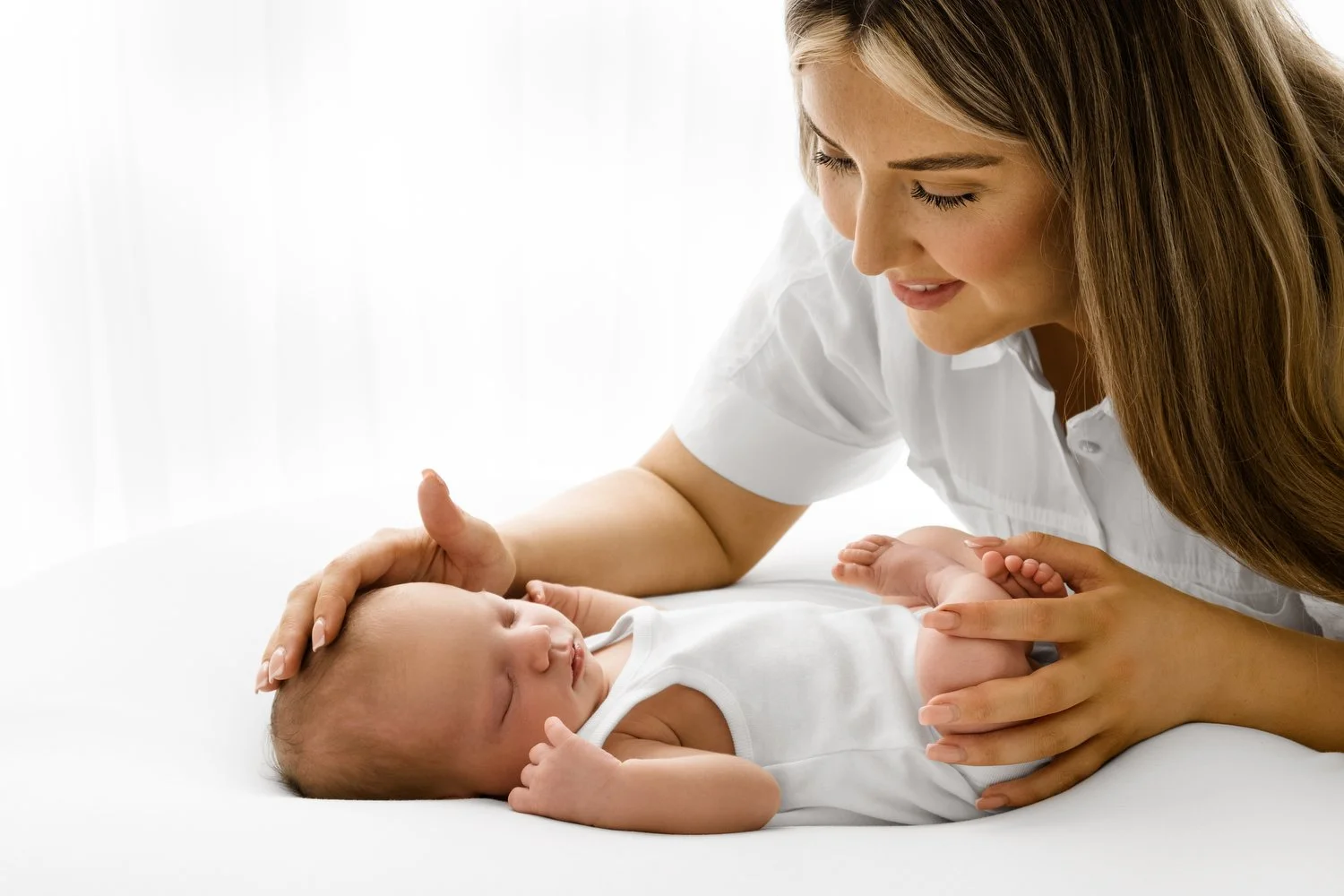 mum with newborn in simple white style
