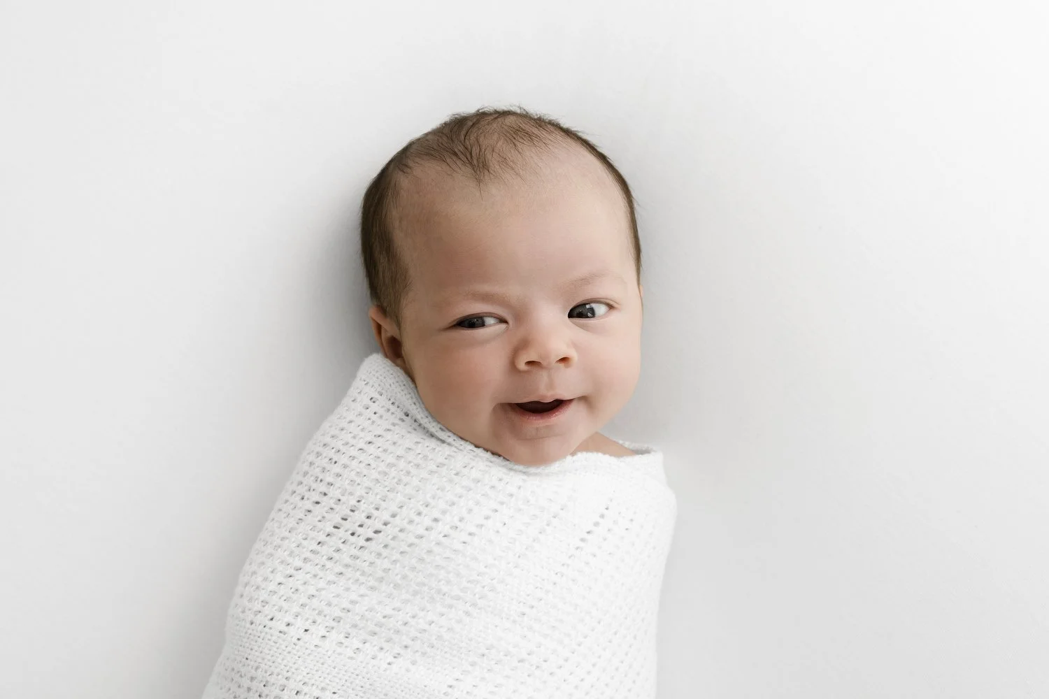 Awake newborn baby face close up at Mabel and Moose studio by Ally Stuart-Ross