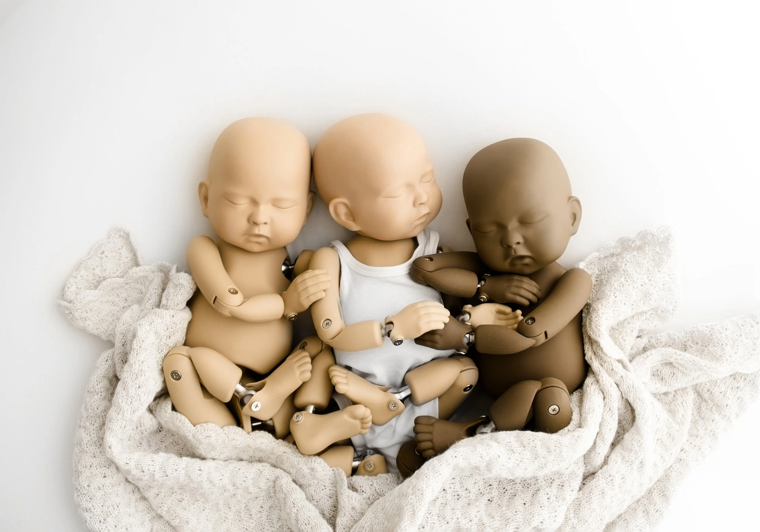 three stand in babies. dark and light skinned for newborn photography mentoring