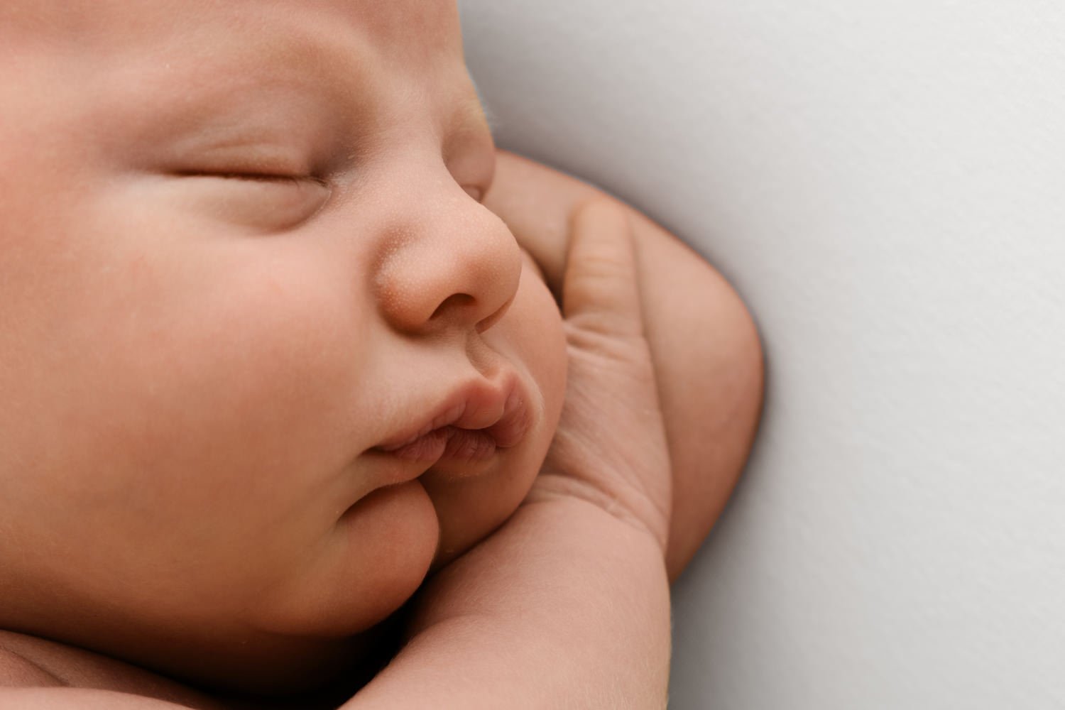 Wider newborn detail shot showing baby lips nose and cheek by Ally Stuart-Ross Mabel and Moose Education