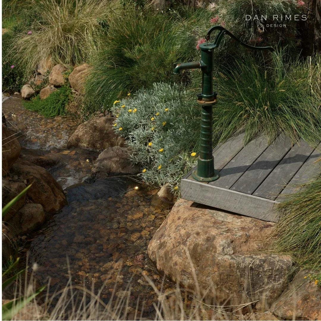 Why every garden needs play...

This creekside deck and handpump nestled within native edge planting invite children to explore, imagine and adventure.

Through climbing, wading, grabbing, and balancing, they engage with the environment - learning th
