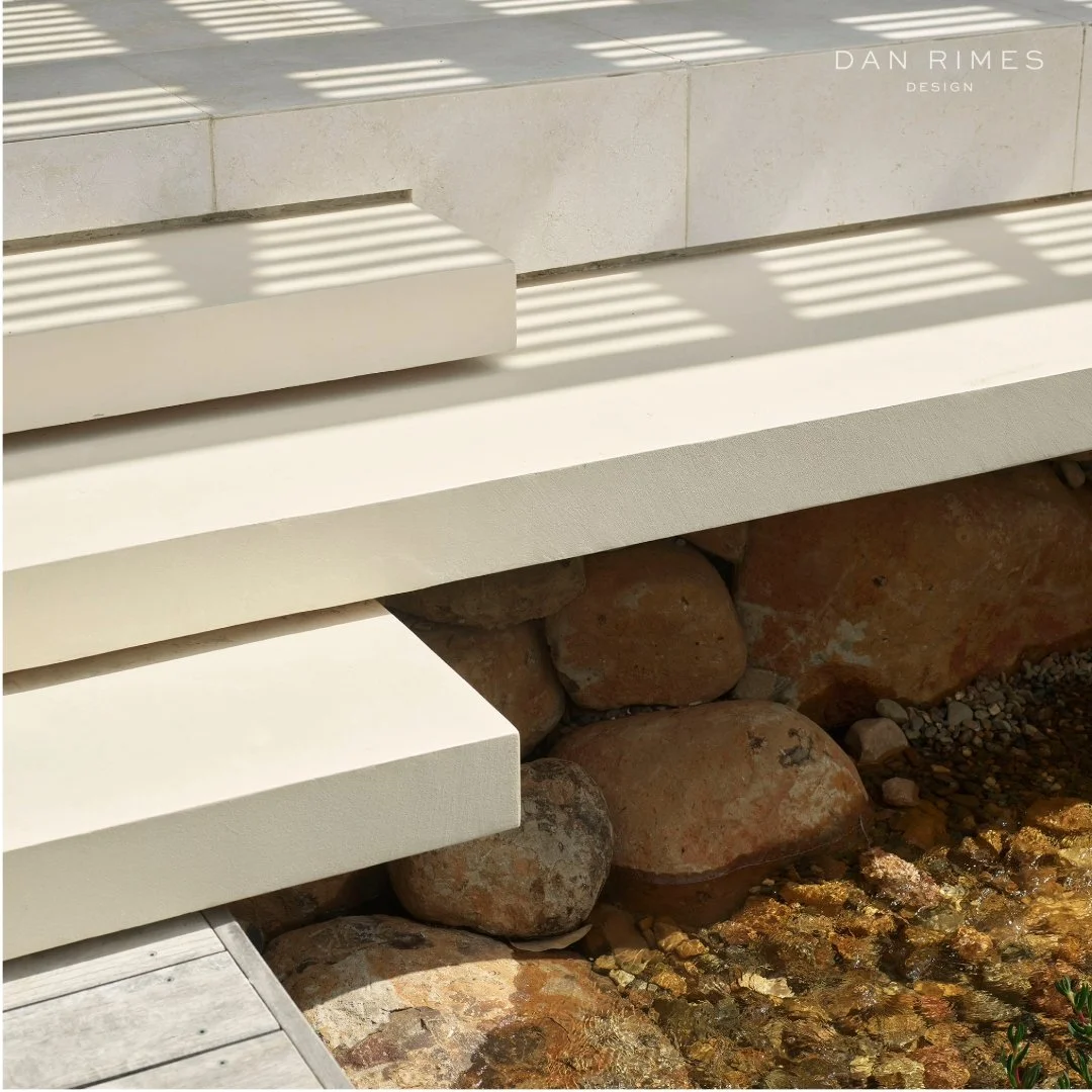 Nature x Built-form
Coastal Haven edge detail: natural rock boulders create a striking contrast against monolithic geometry.

Frank Lloyd Wright inspired the world with Fallingwater, almost a century ago - a masterpiece where staggered massing, combi