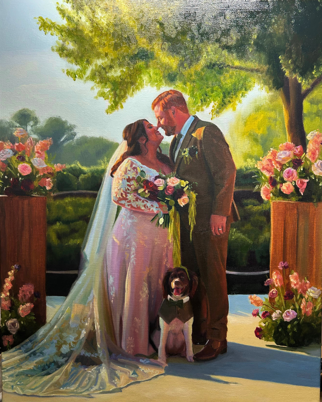 A painting of a newlywed couple at their wedding ceremony, standing outdoors under a large tree, facing each other with foreheads touching. The bride is holding a bouquet and wearing a white lace wedding dress, while the groom is dressed in a dark suit. A brown and white dog wearing a bow tie is sitting at their feet. The scene is decorated with pink and white flowers on wooden pedestals, with sunlight filtering through the leaves.