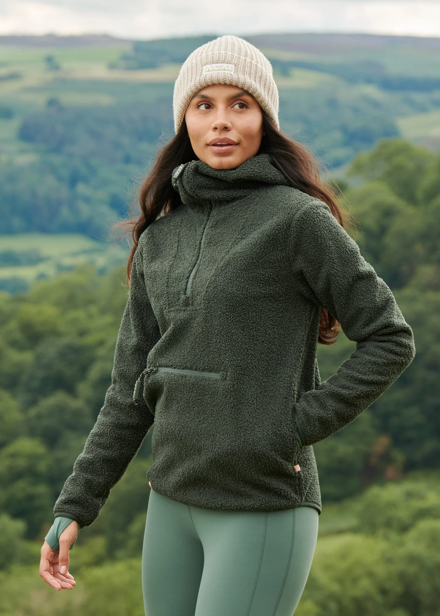 A shot of a model wearing outdoor wear in the countryside
