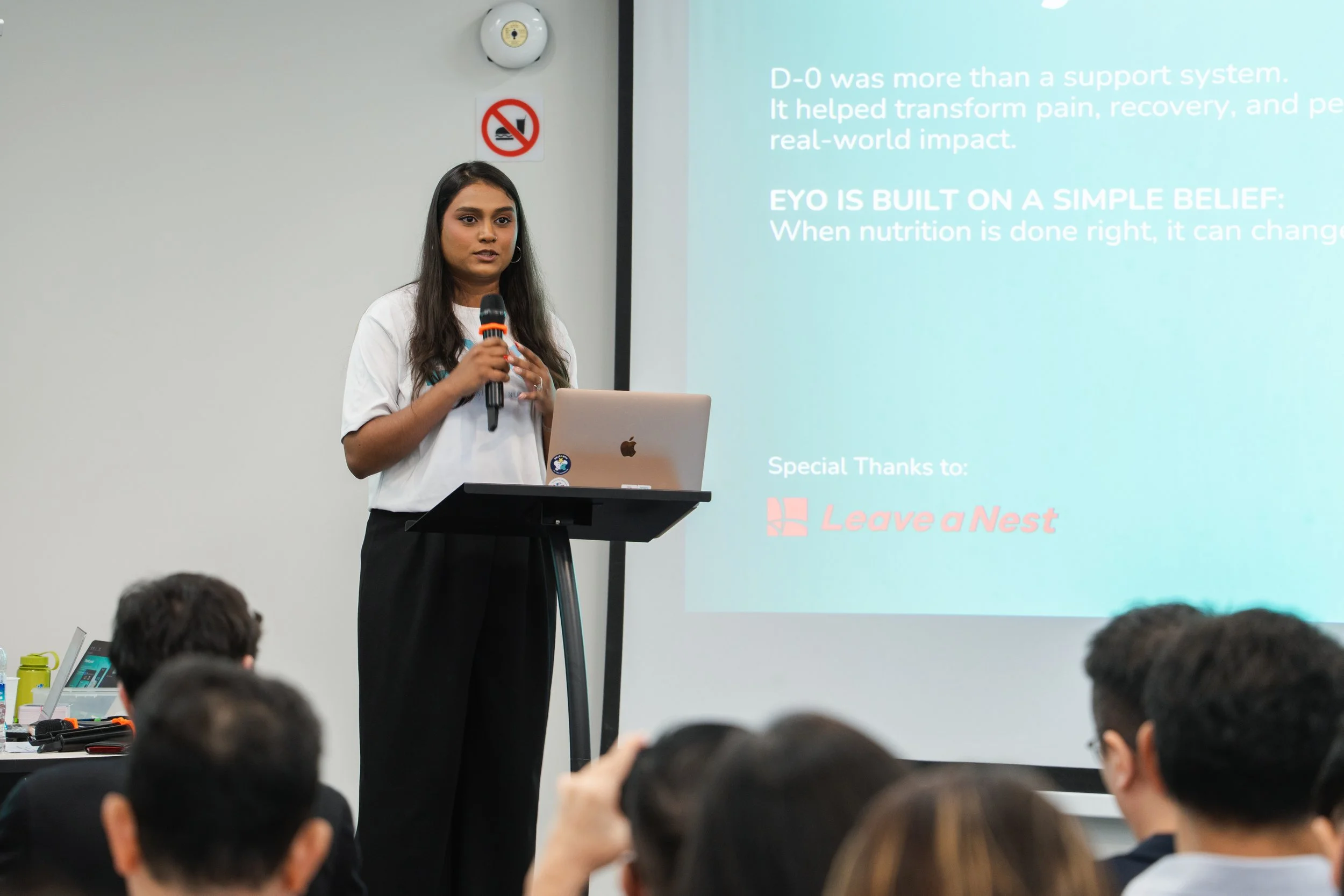 ItsGabby Marketing Founder presenting on stage during a Forum
