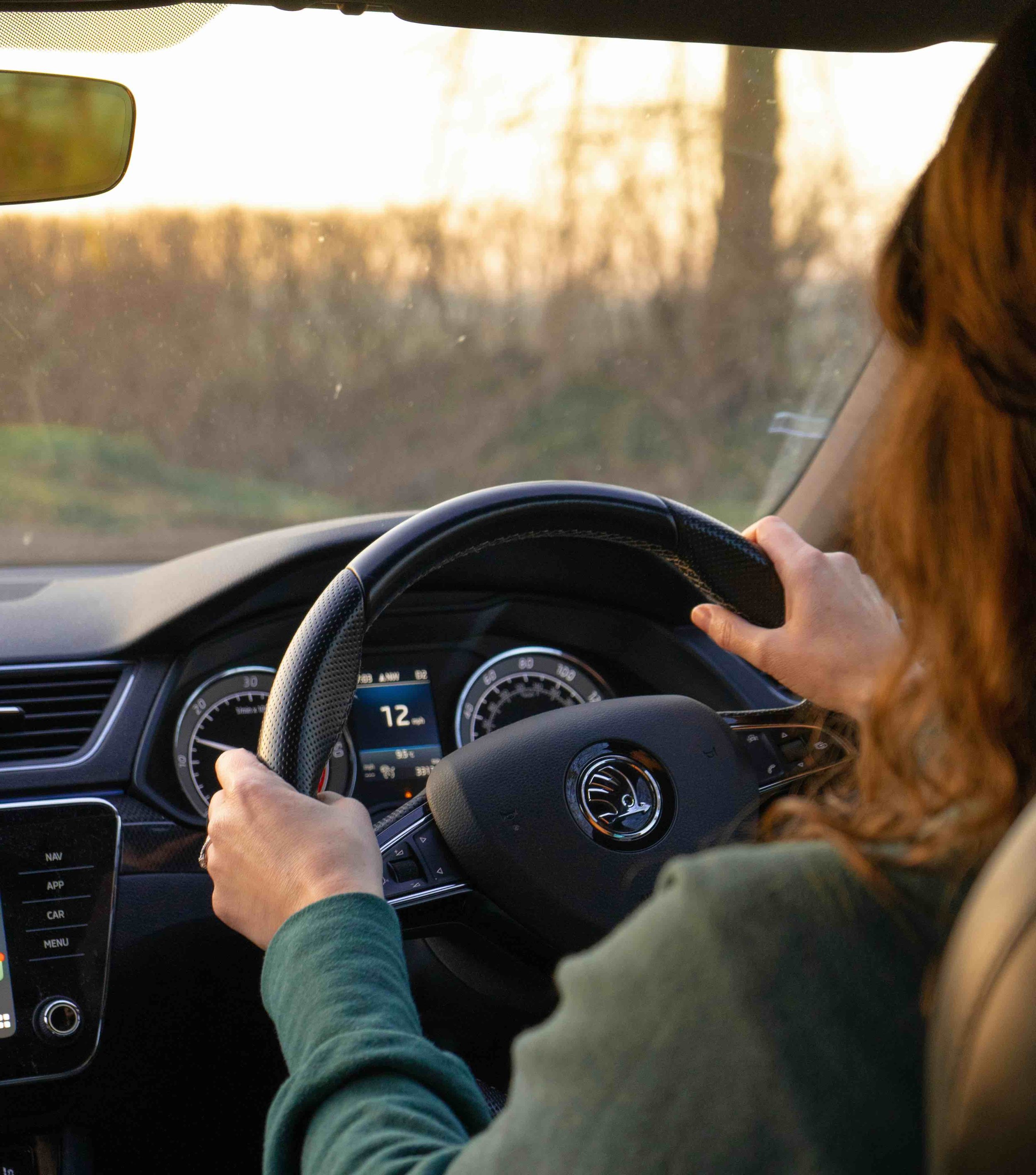 Woman driving confidently to show how therapy can improve driving anxiety