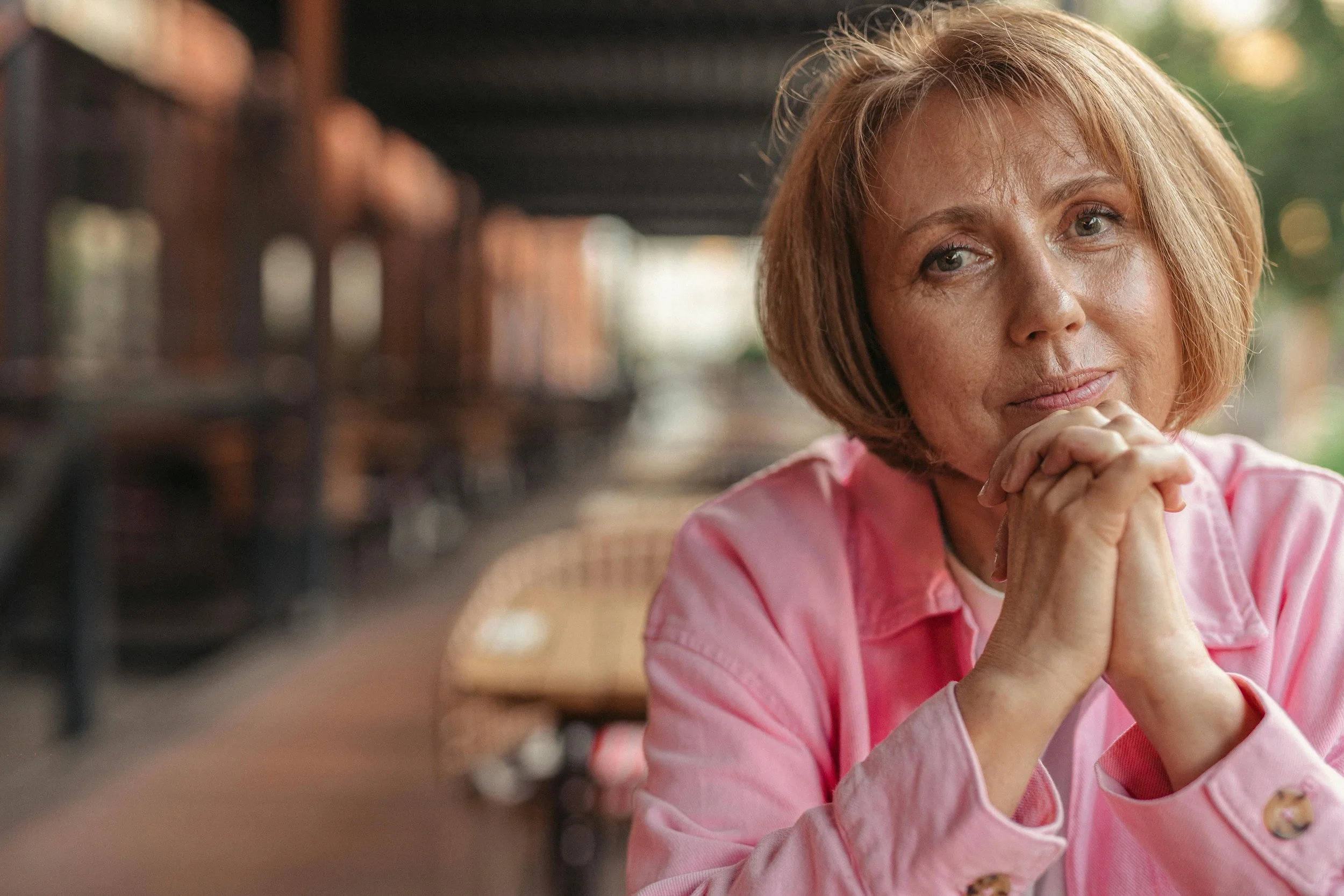 Midlife woman looking thoughtful