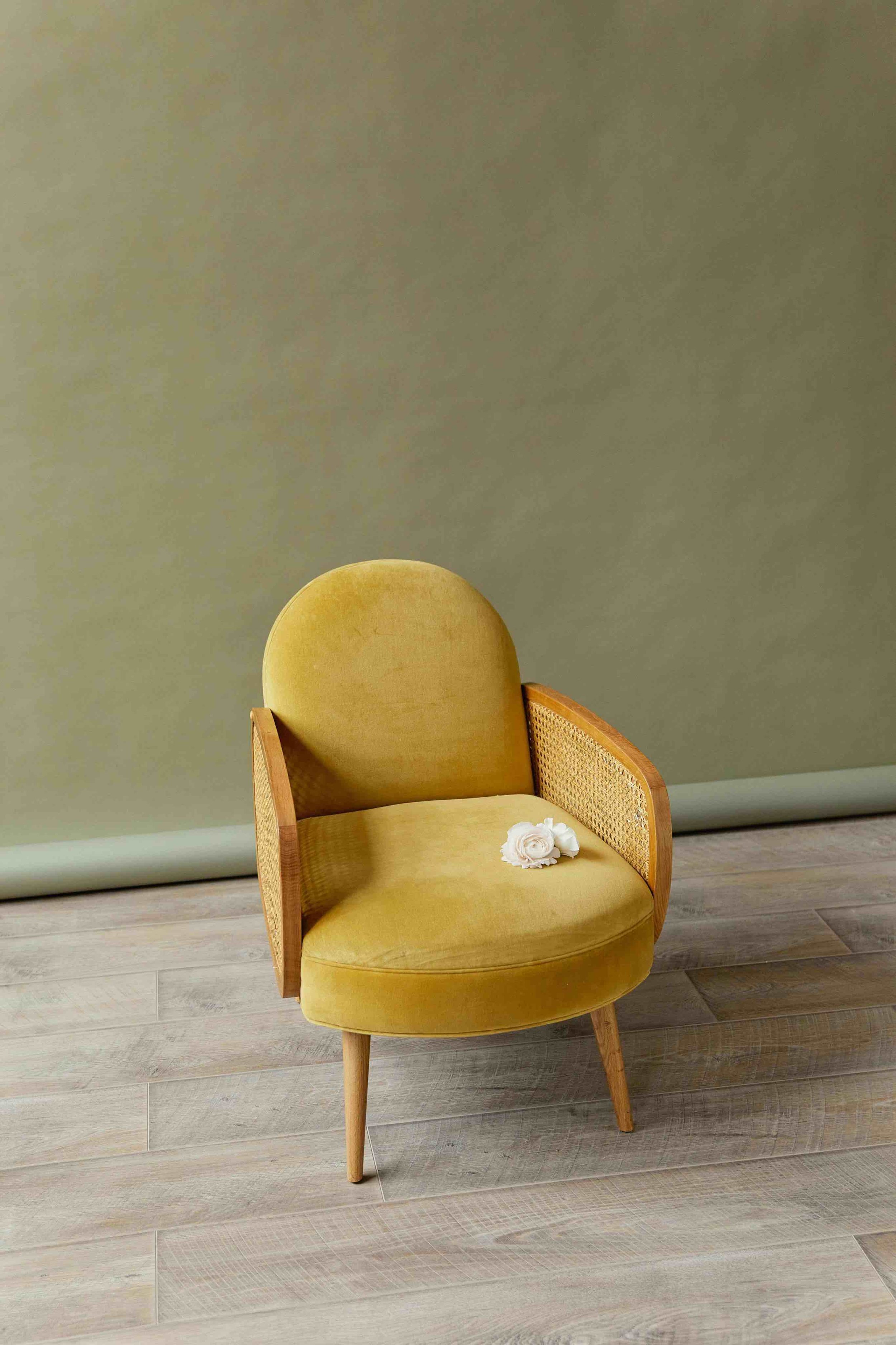 empty chair with single flower representing loss