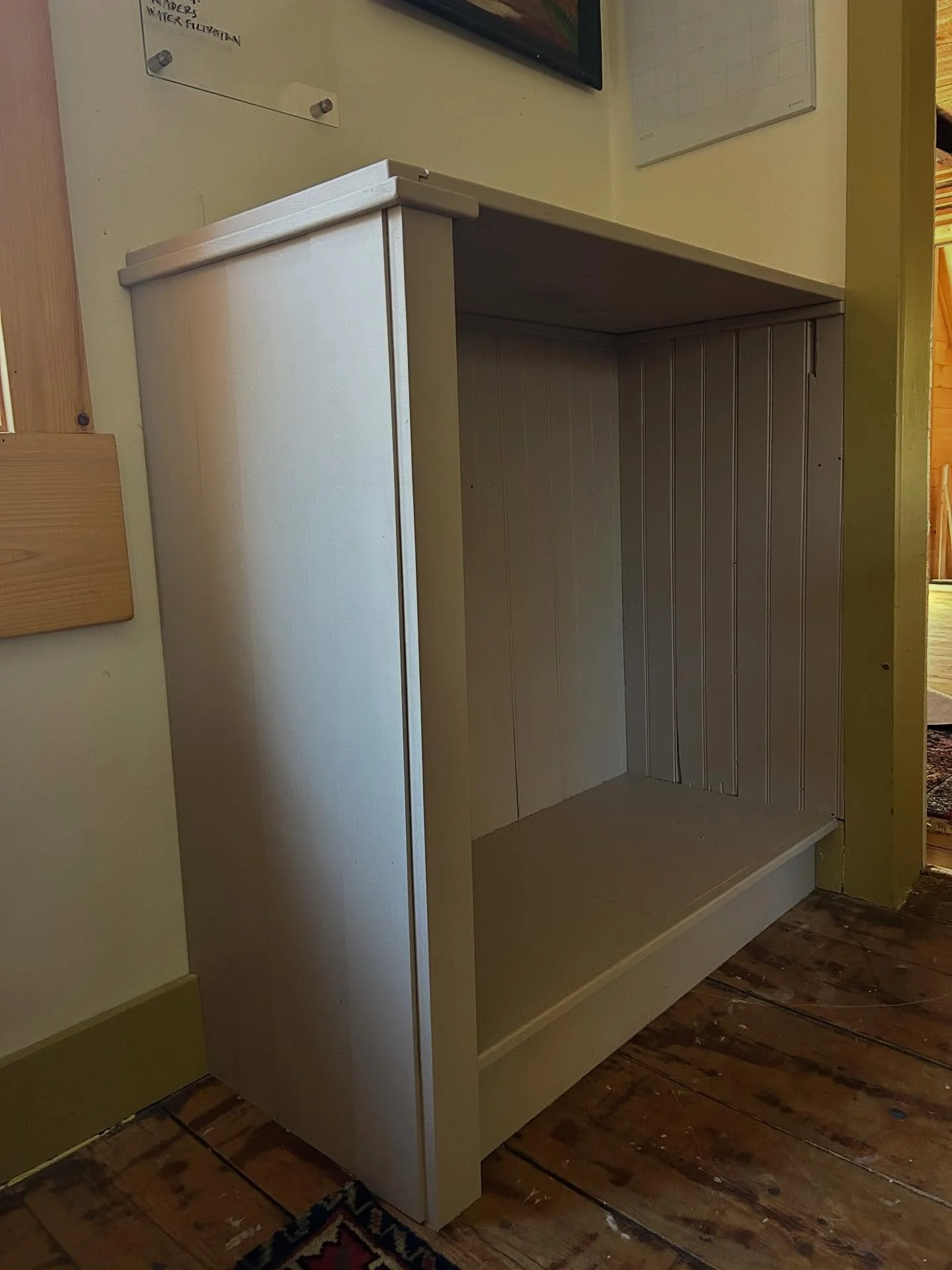 A new built in for our house mainly used for firewood in winter and beach bag in summer. The paint is left over from our attic where we dumped all our sample paint together. The bead board is salvage from an old door. And the pine is from our local m