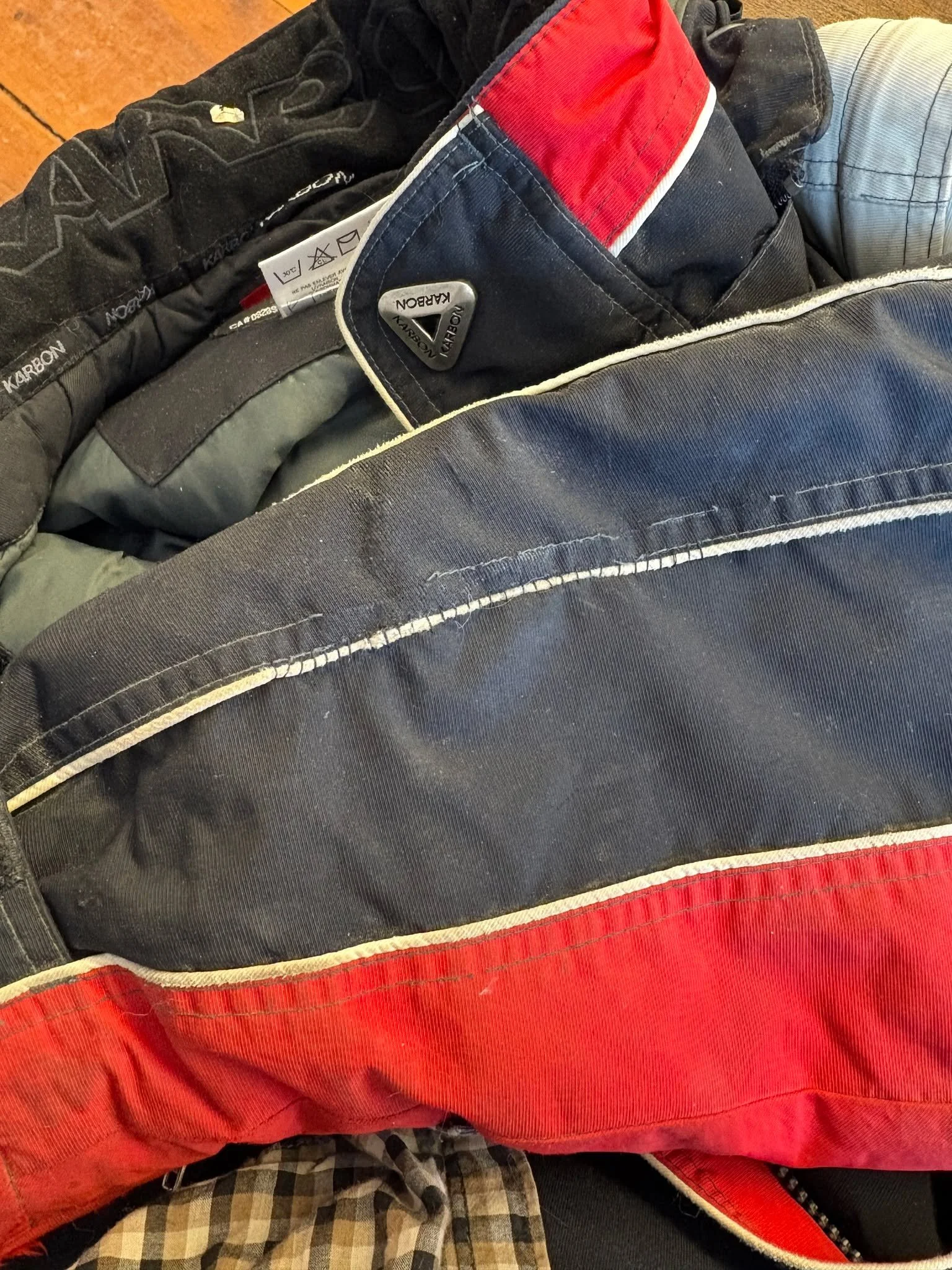 Some of the projects worked on at the Morrill Cafe. Mending completed on site. A seam tear on a winter coat, a hole in a knitted jacket, and a shortened pant hem on carhart's.