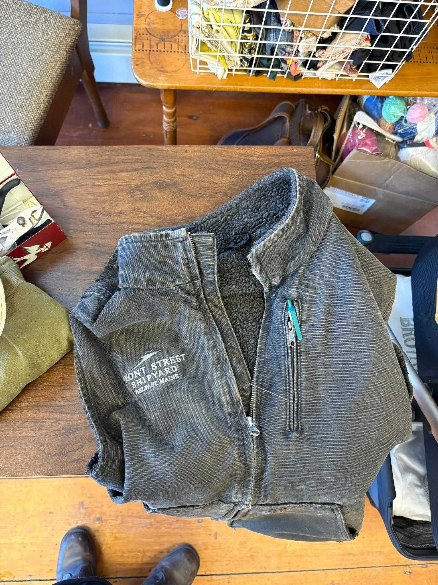 The zipper toggle on this vest was broken off. There is a relatively easy way to change the zipper pull out. I was able to fix it after he dropped it off in the morning and before his afternoon work ~ just took a little bit of time.
