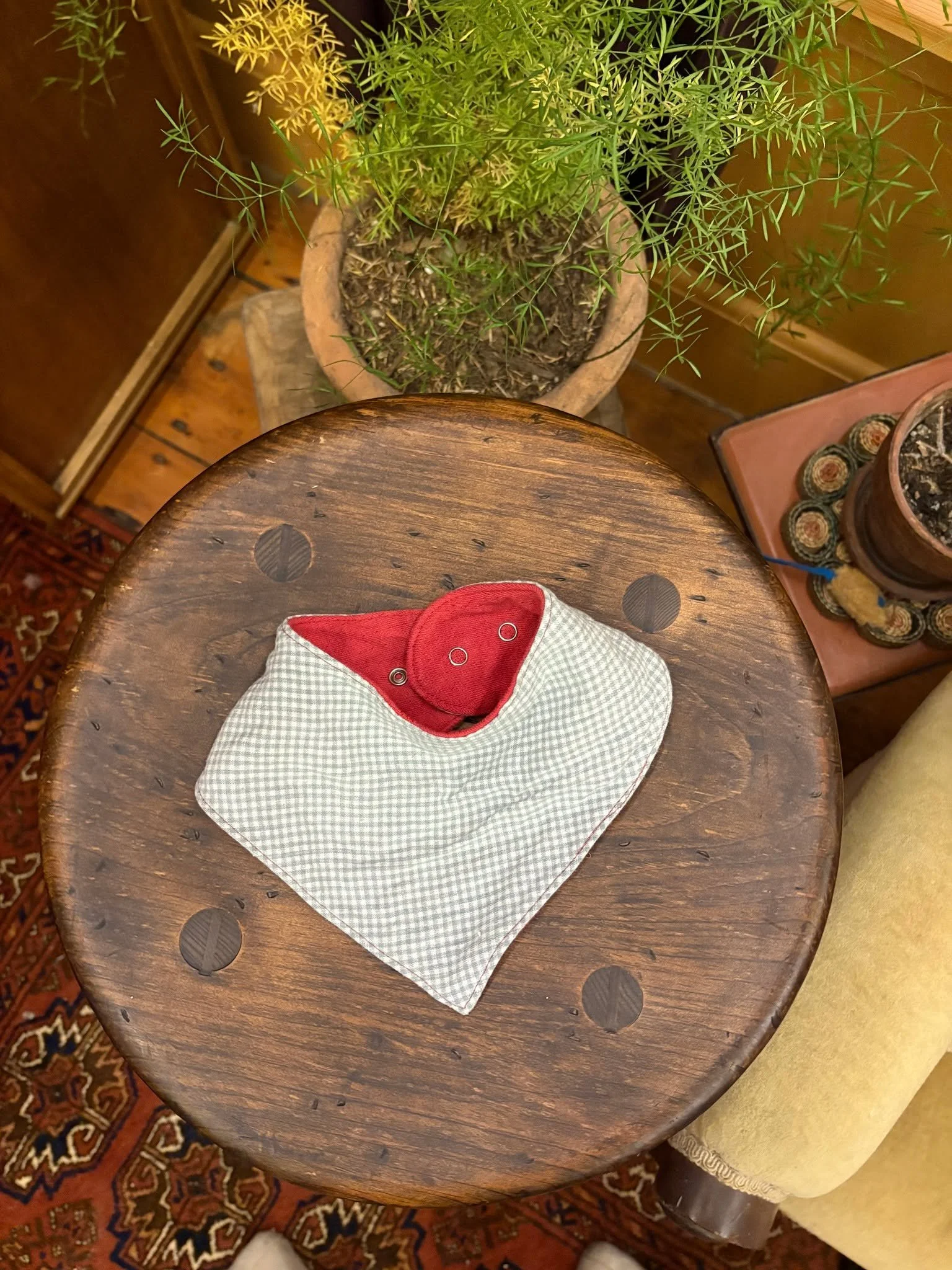 A lil baby bib from x-large red knitted LL Bean mens footie pajamas and a checkered linen top. I am also hoping to make a cardigan from the red knit fabric.