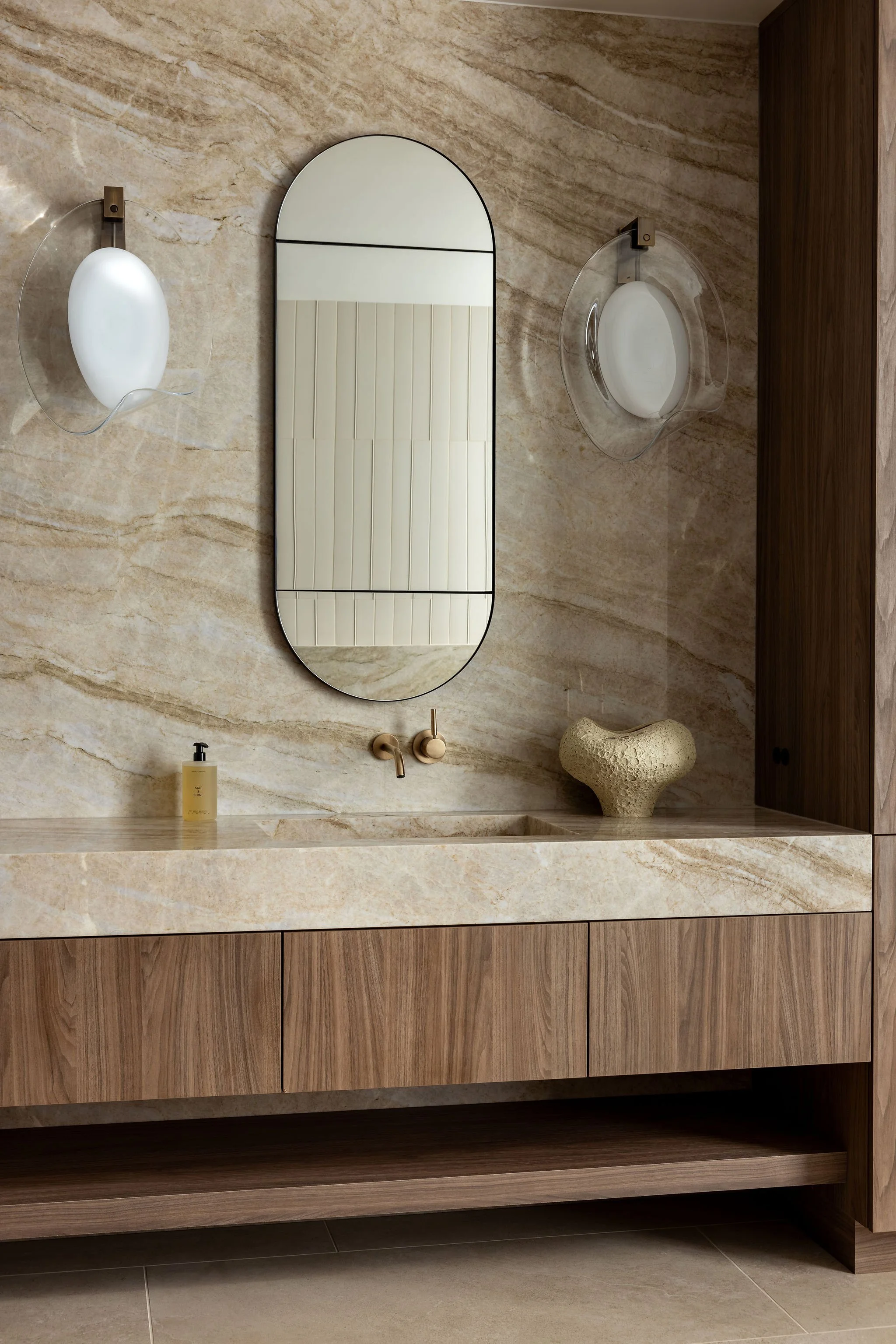 Modern primary bathroom with floating cabinet vanity, double sinks