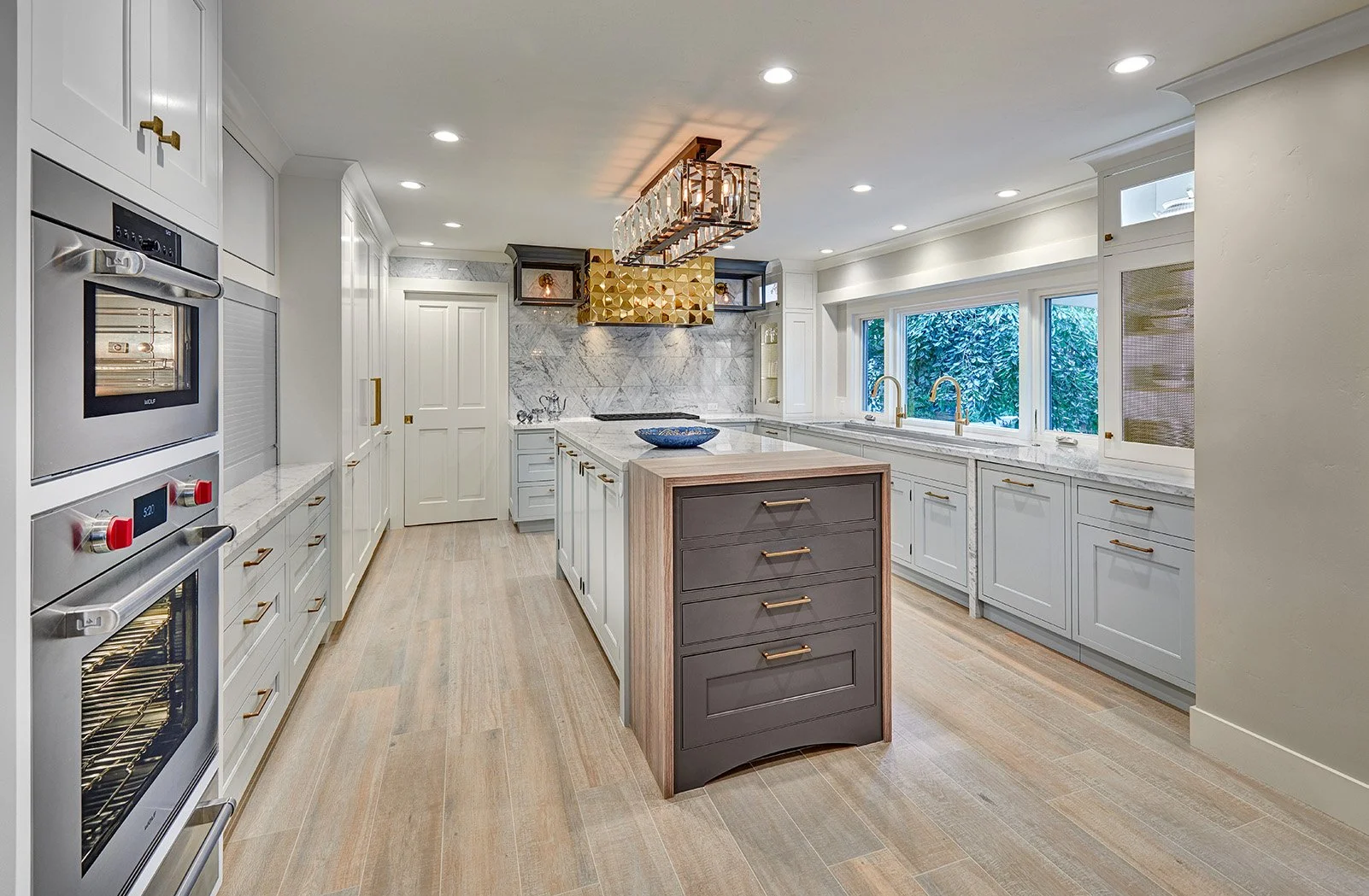 Whole home remodel, glamorous kitchen, white cabinetry, Wolf appliances, appliance garage, large island, The Galley workstation