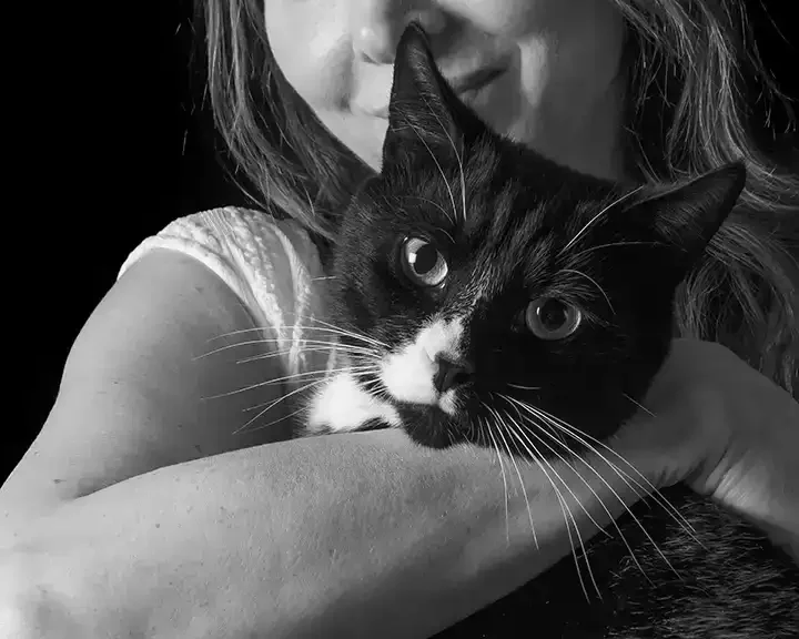 Black and White Portrait of a person holding a cat