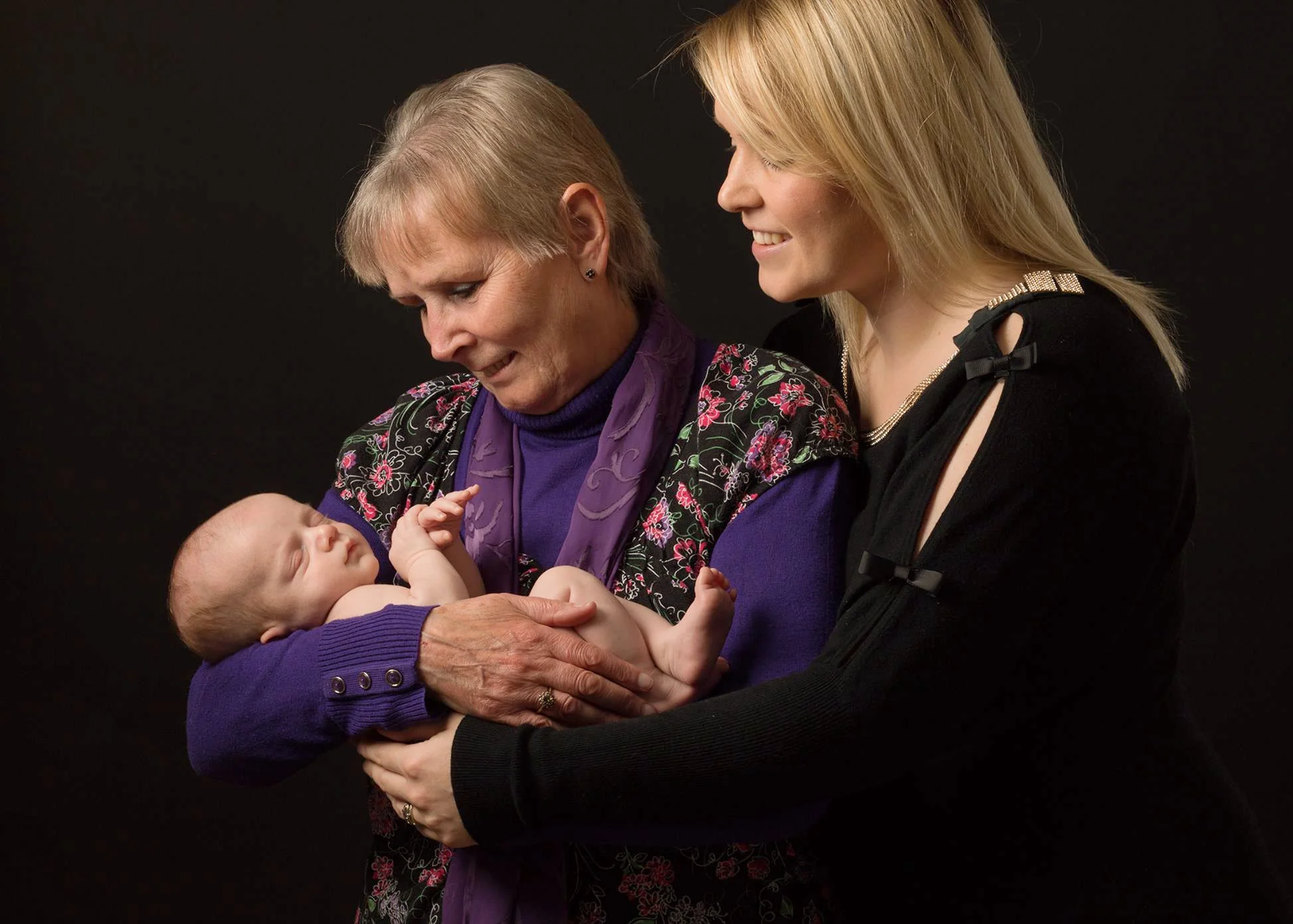Mother and Grandmother holding baby