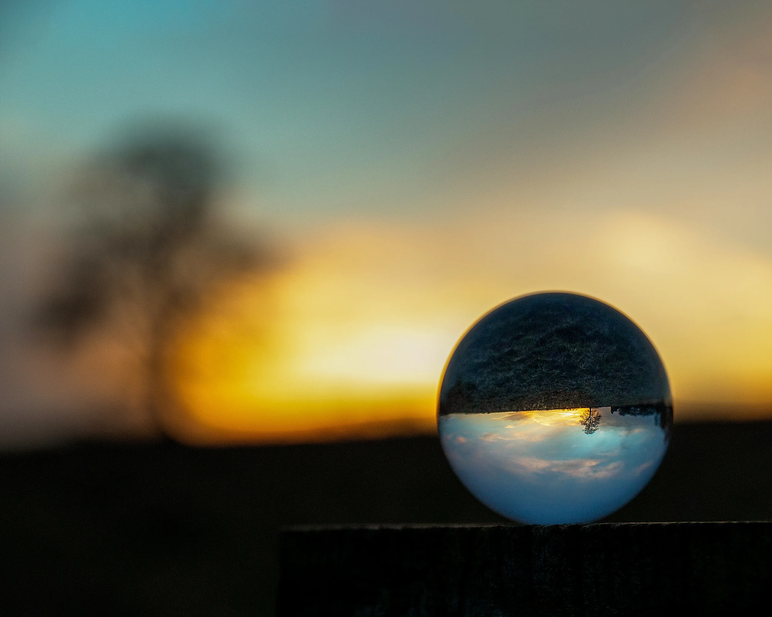 Glass Sphere reflecting a sunset landscape