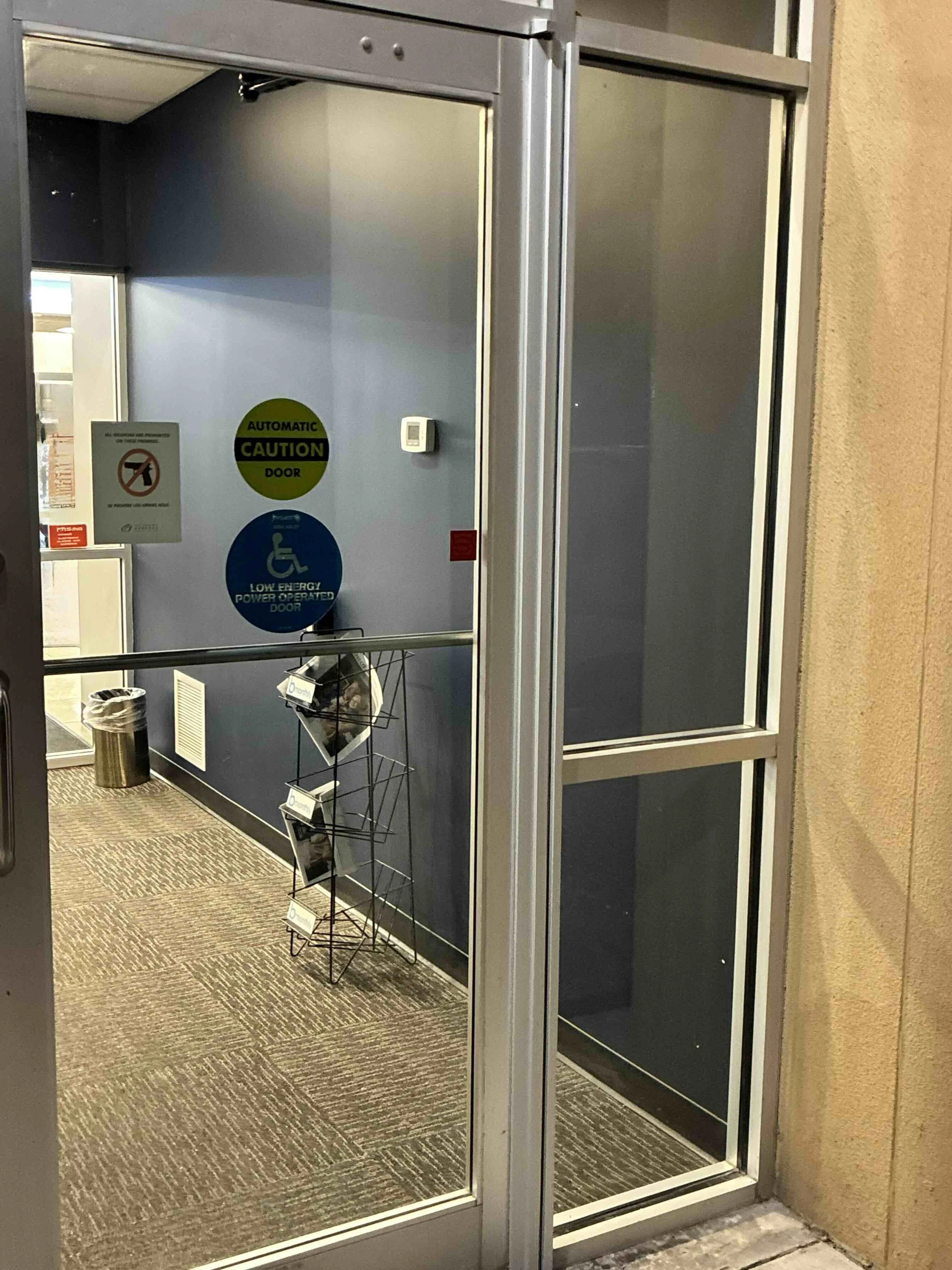 Commercial Door Repair in Bartlesville Oklahoma by Apex Doors. A full surface continuous hinge replaced the failing pivot hinges on this aluminum storefront door.