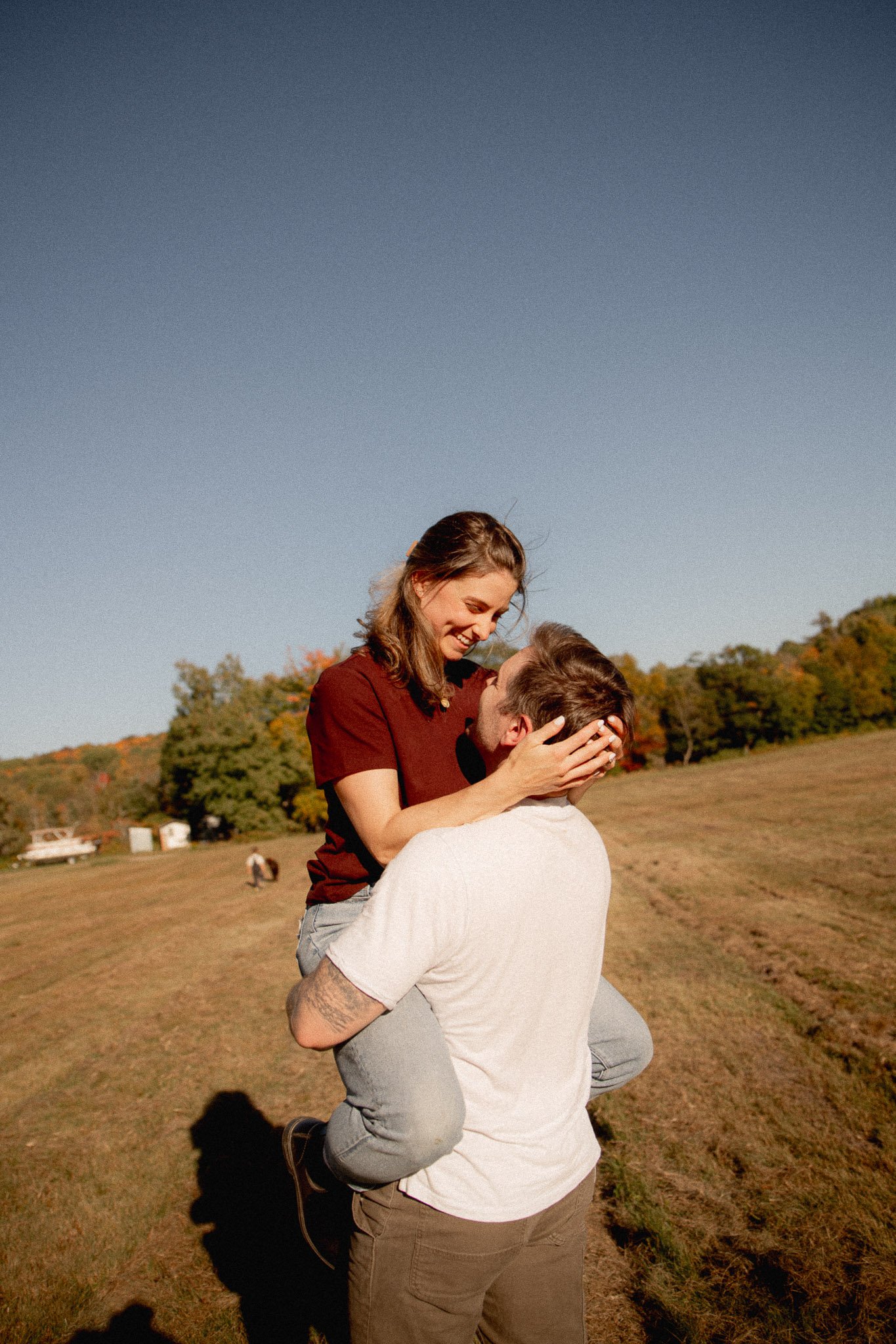 couple in a field at golden hour