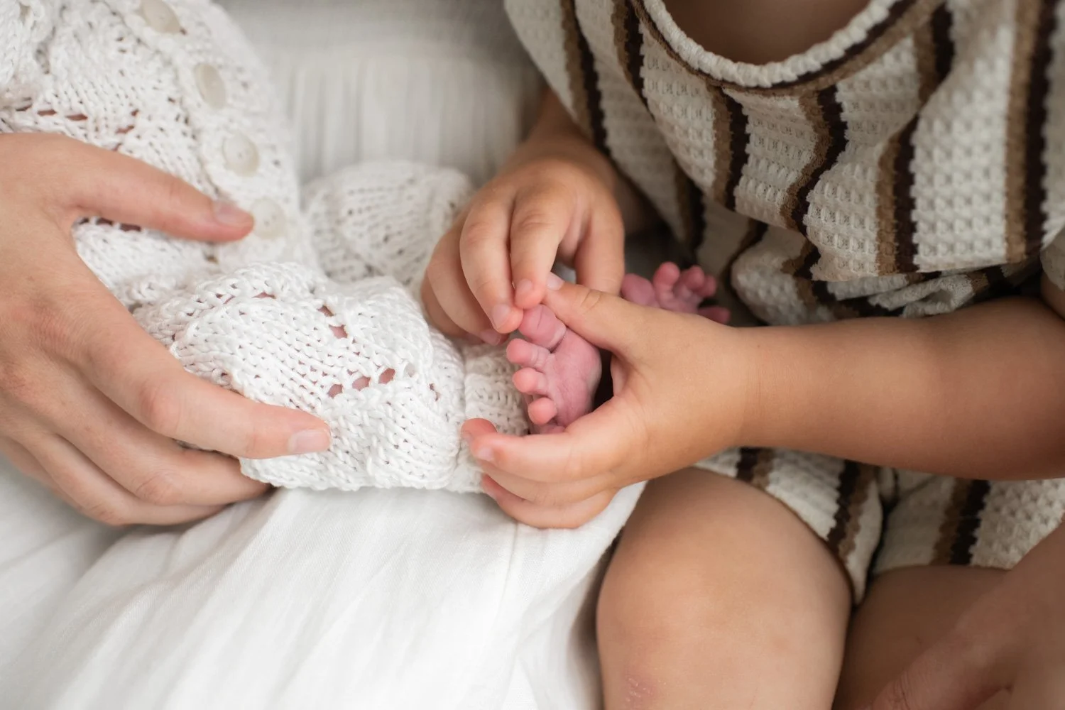 studio photography baby toes and big brother
