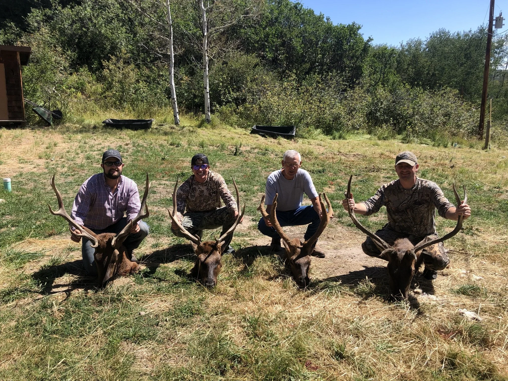 8. AE - 4 guys with 4 elk head.jpeg
