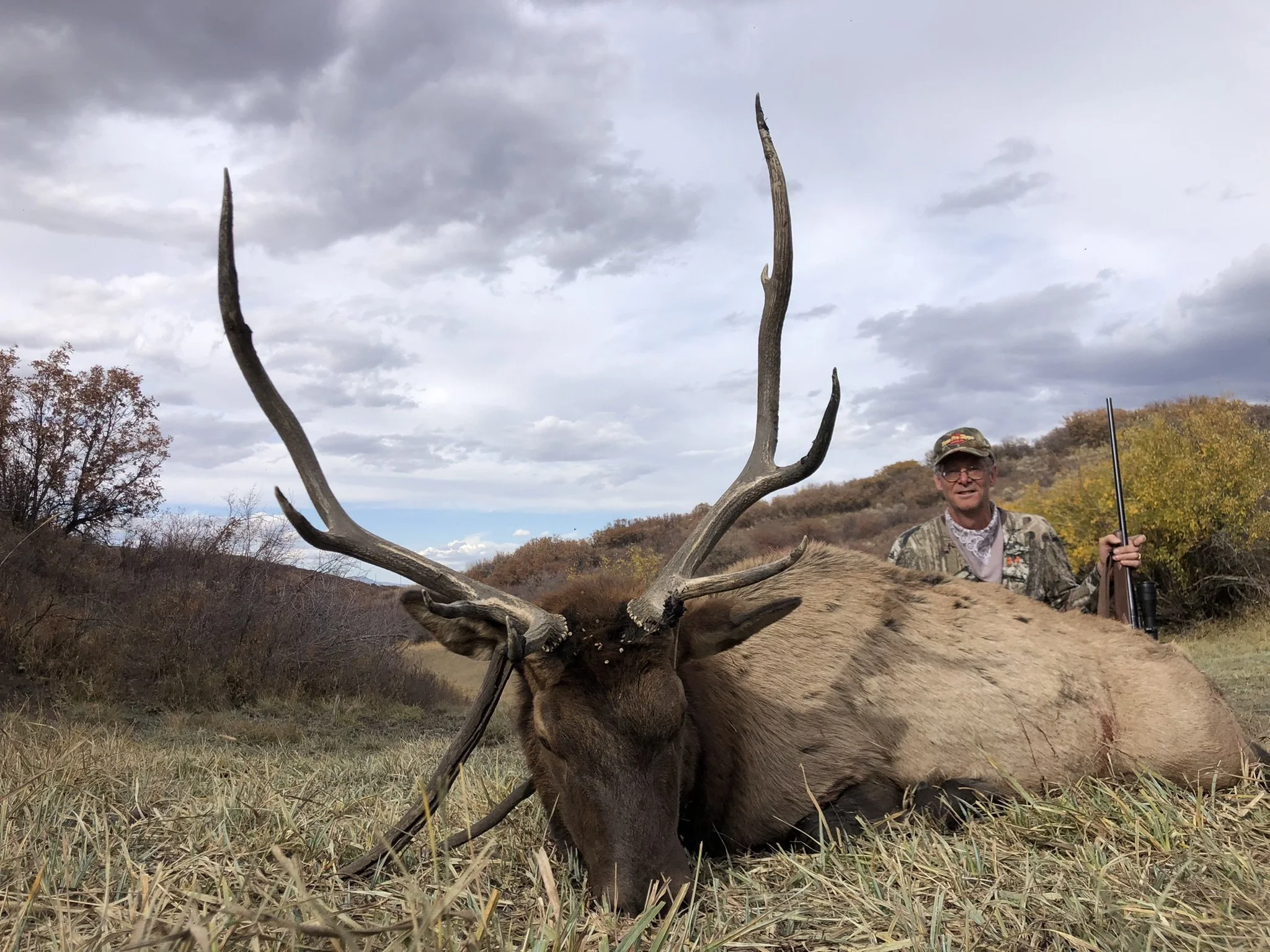 2. RE - Dr Vineyard sitting behind elk with gun.jpeg
