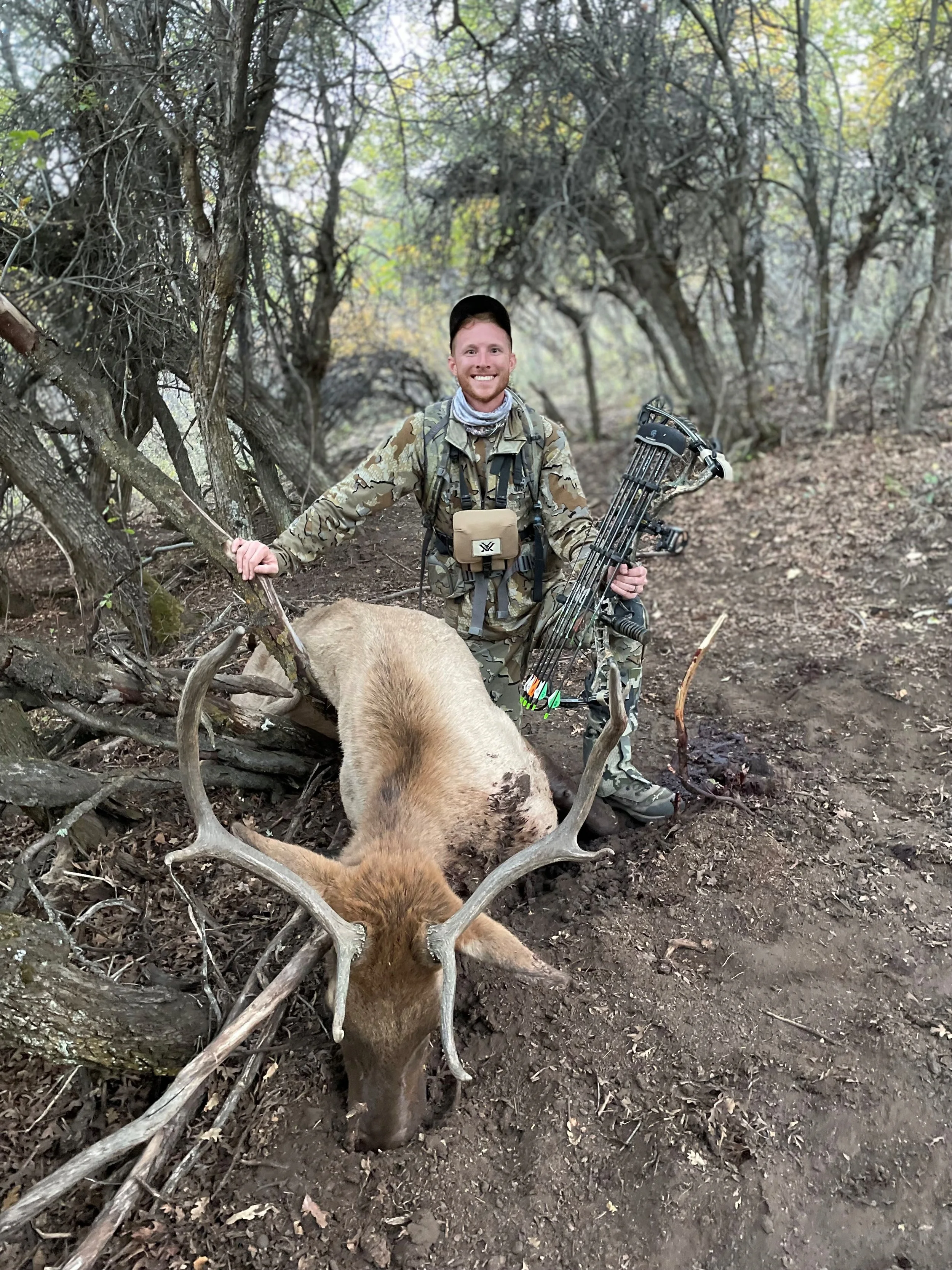 13. AE - Young smiling boy with bow and elk.jpg
