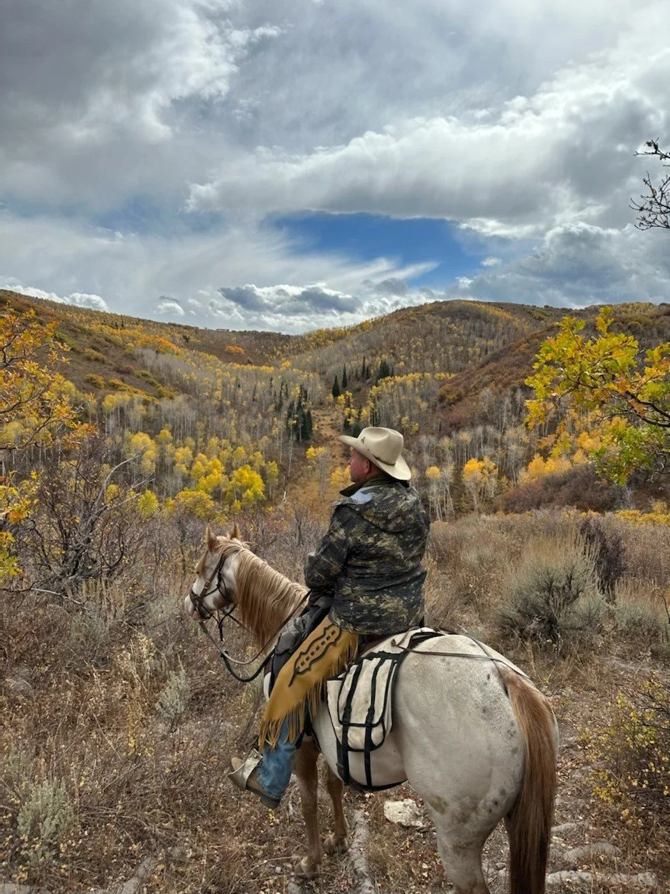 33. RV - Jeff on horse cloudy sky.jpg