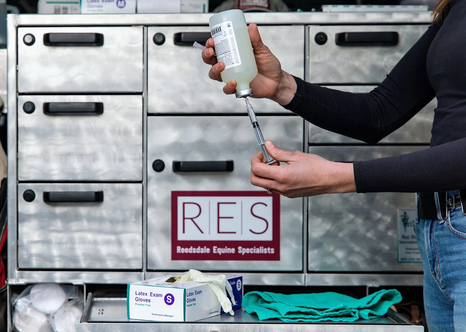 Pink Nike sneakers with white soles and grey Nike swoosh logo floating in a blue sky with white clouds.