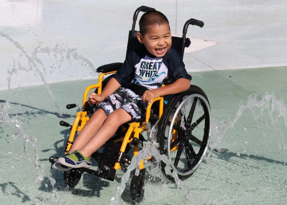 Boy in Wheelchair at Our Special Harbor Sprayground