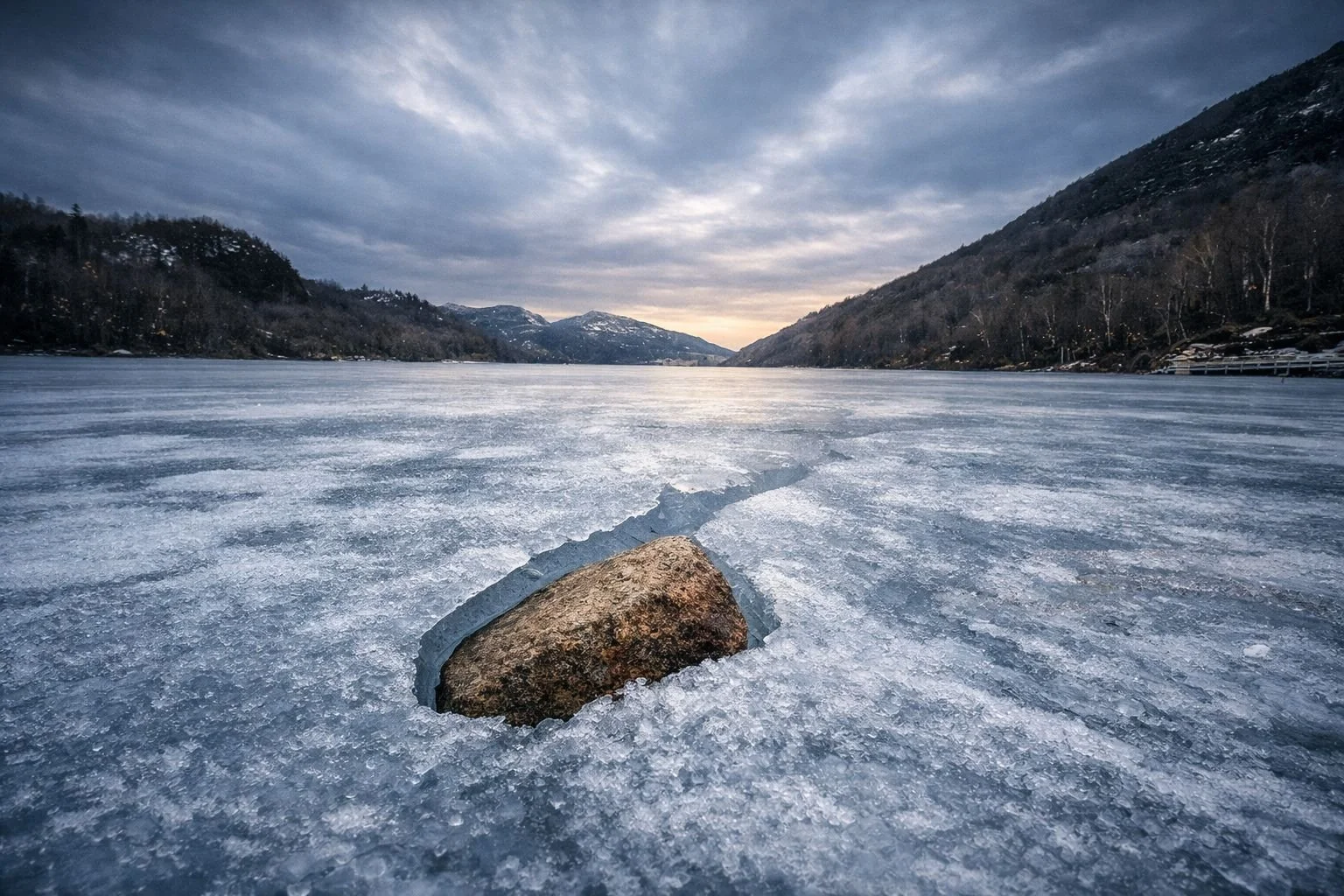 Stone trapped in frozen ice on Tengsdalvatnet lake in Sandnes, Norway.