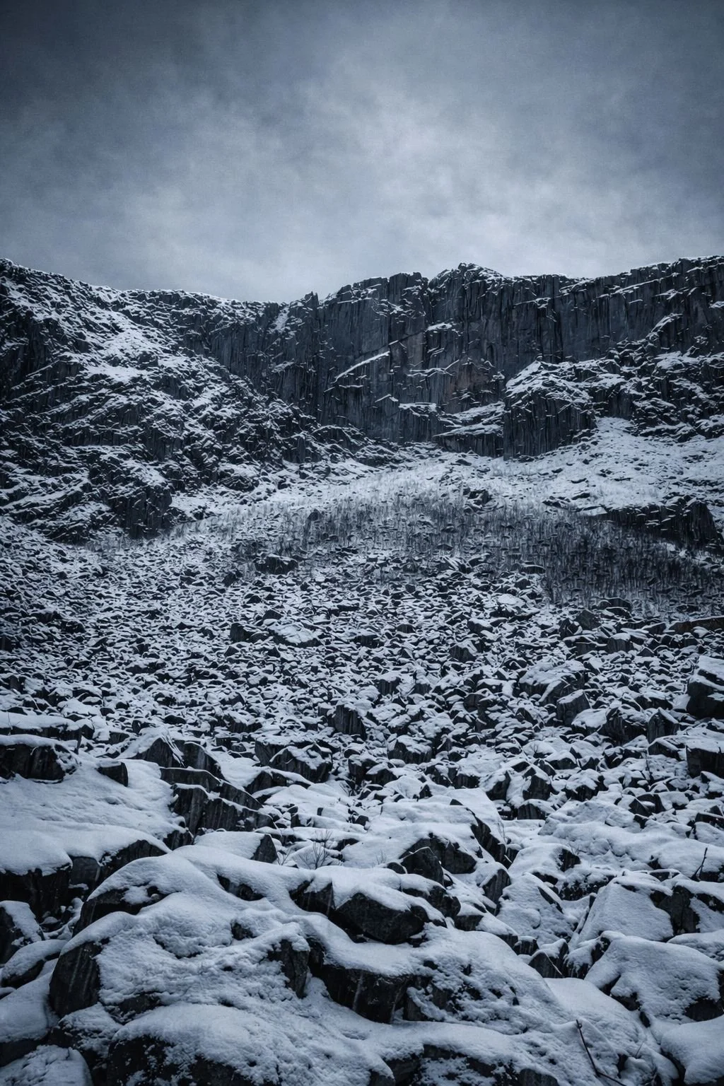 Snow-covered rock formations in Gloppedalsura valley in Rogaland, Norway during winter.