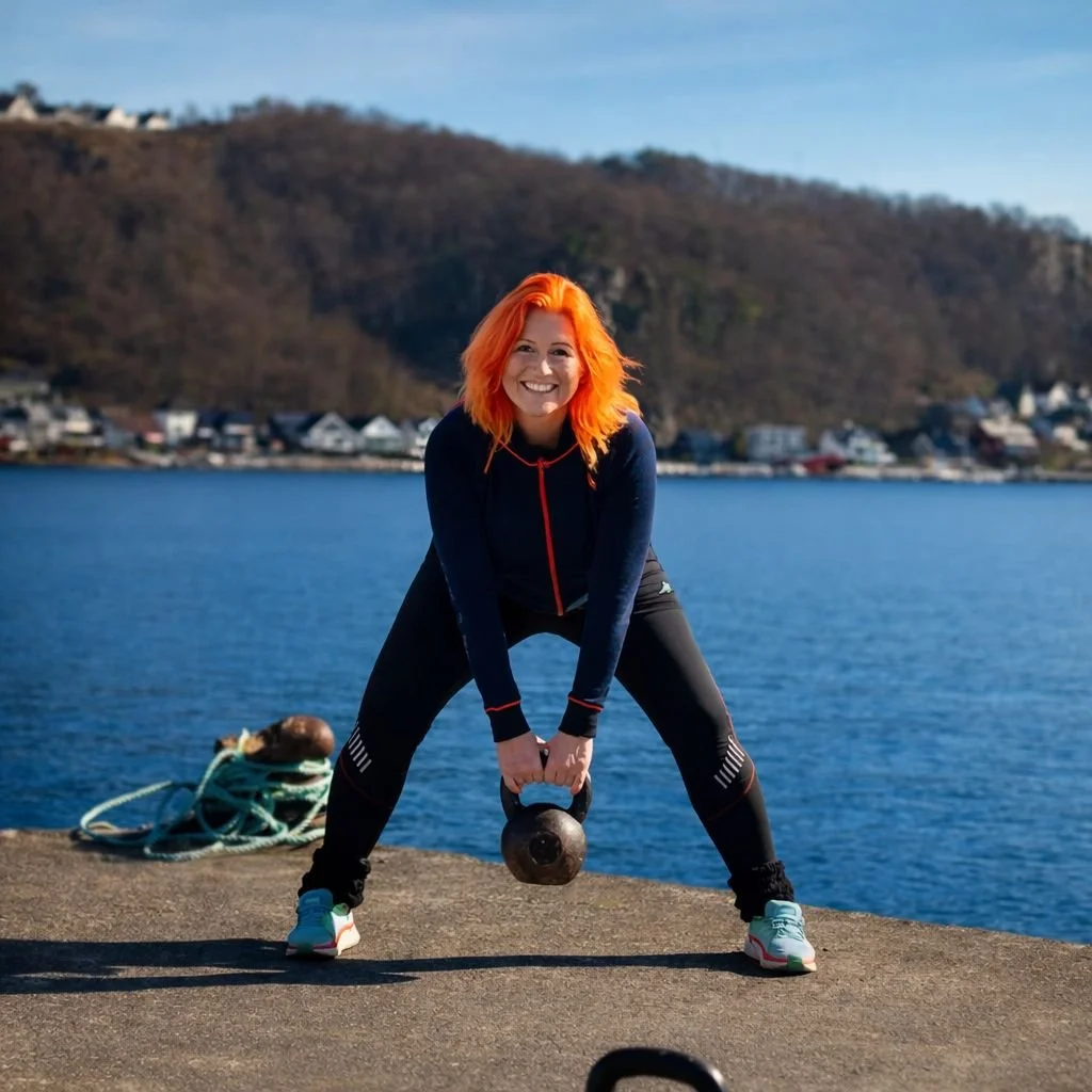 Solveig Fredriksen, Norwegian health coach based in Sandnes, Rogaland, performing kettlebell training by the waterfront.