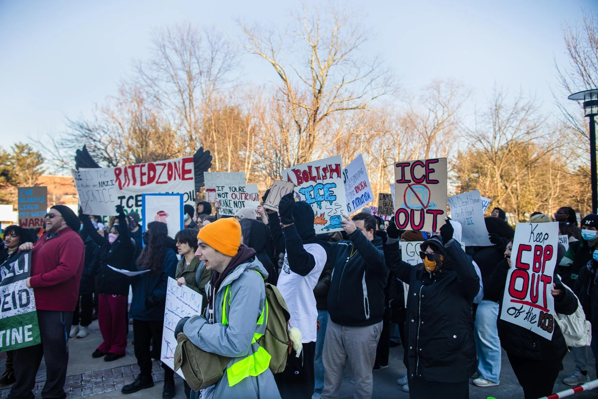  A group of protestors shouting and raising their signs in the air. Thurs. Feb 5, 2026. (Photographer: Joe Capuyan) 