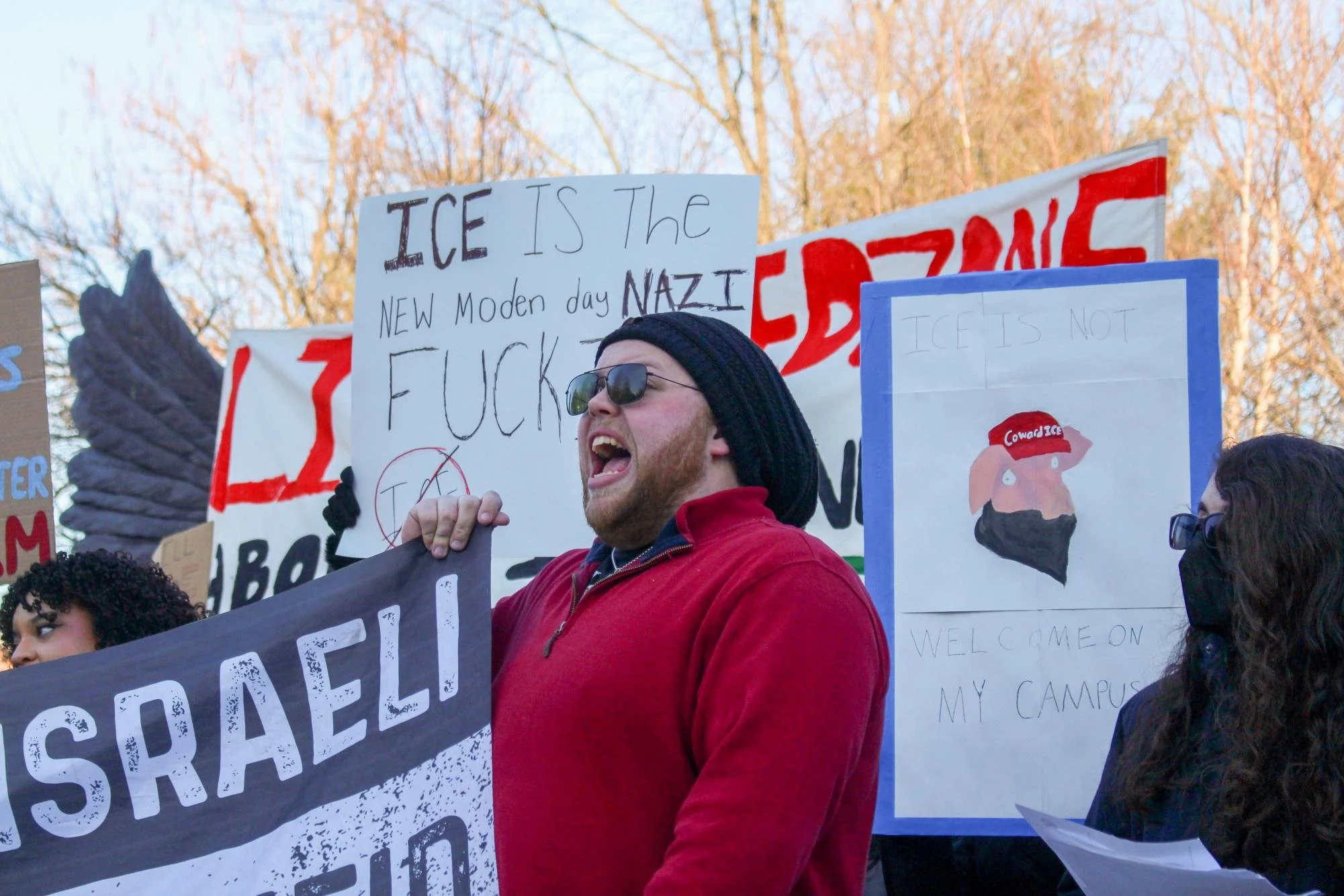  A protester in a red sweatshirt chants along with the crowd. Thursday. Feb 5, 2026. (Photographer: Aidan Vanhoof) 