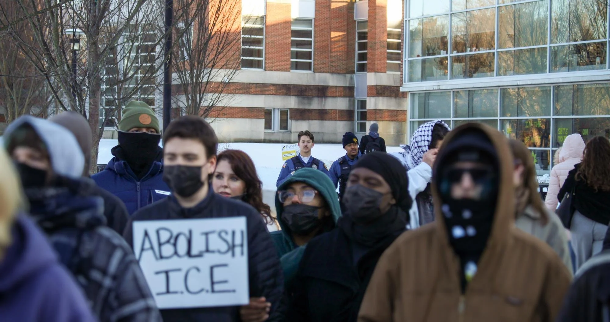  Officers of The Rowan University Police Department stand at the back of the crowd. Thursday, Feb 5, 2026. (Photographer: Aidan Vanhoof) 