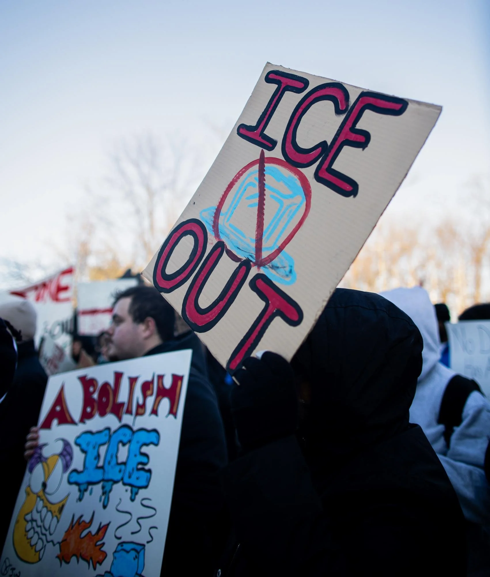  A protestor with an “ICE Out” sign stands across from Owl Statue. Thursday, Feb 5, 2026. Glassboro, N.J.(Photographer: Joe Capuyan) 