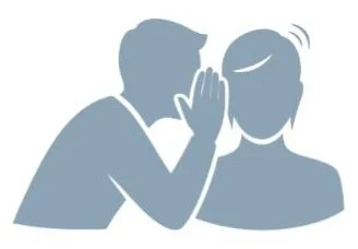 Person whispering into another person's ear