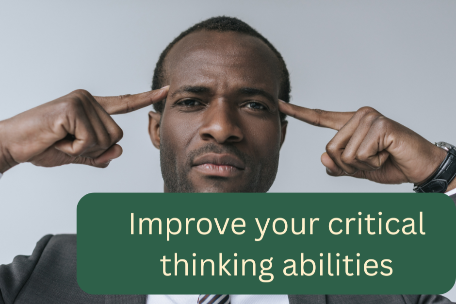 A man making a thinking gesture with his fingers on his temples, with a serious expression, wearing a suit and tie.