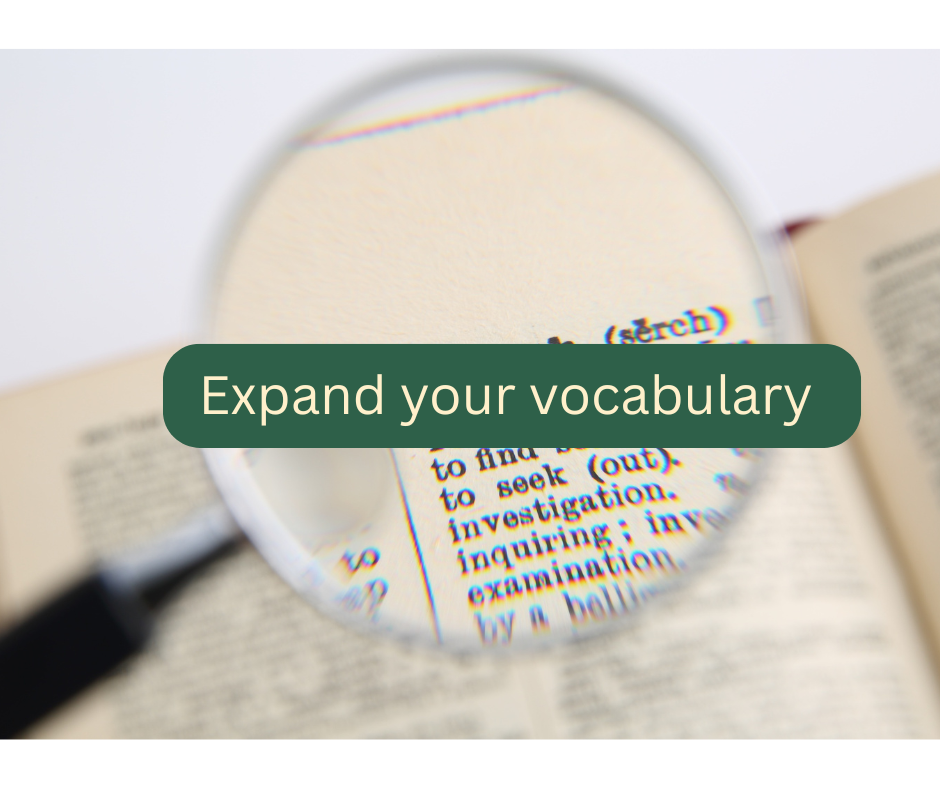 Open book viewed through a magnifying glass with the phrase 'Expand your vocabulary' on it.