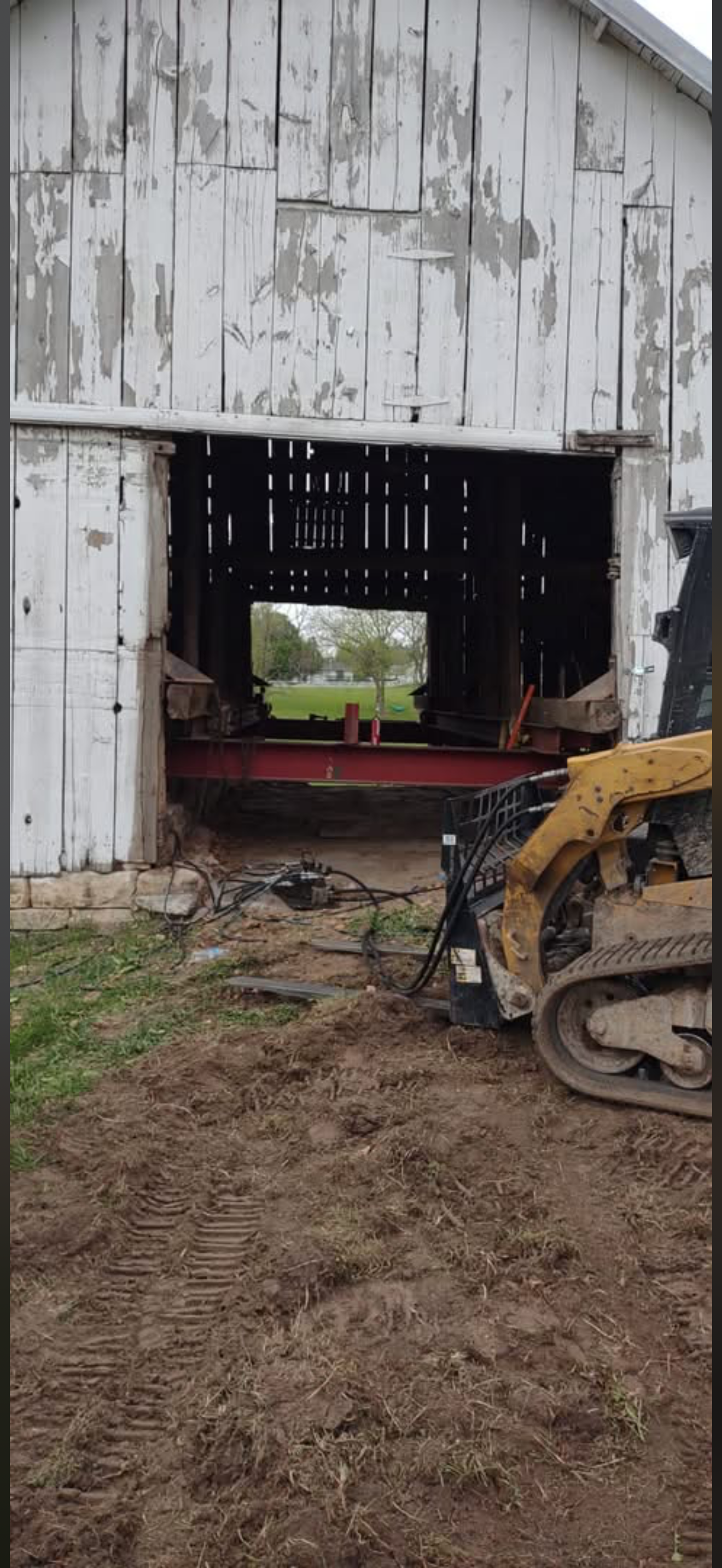 5/5/2026 Meyers Farmstead Historic District corn crib/hog barn starting restoration with lifting the barn to allow for restoration work on the foundation.