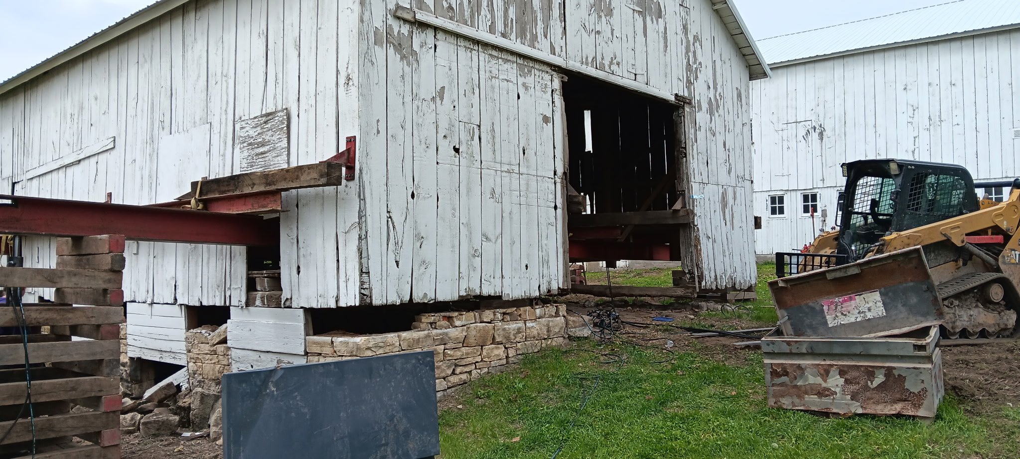 5/5/2026 Meyers Farmstead Historic District corn crib/hog barn starting restoration with lifting the barn to allow for restoration work on the foundation.