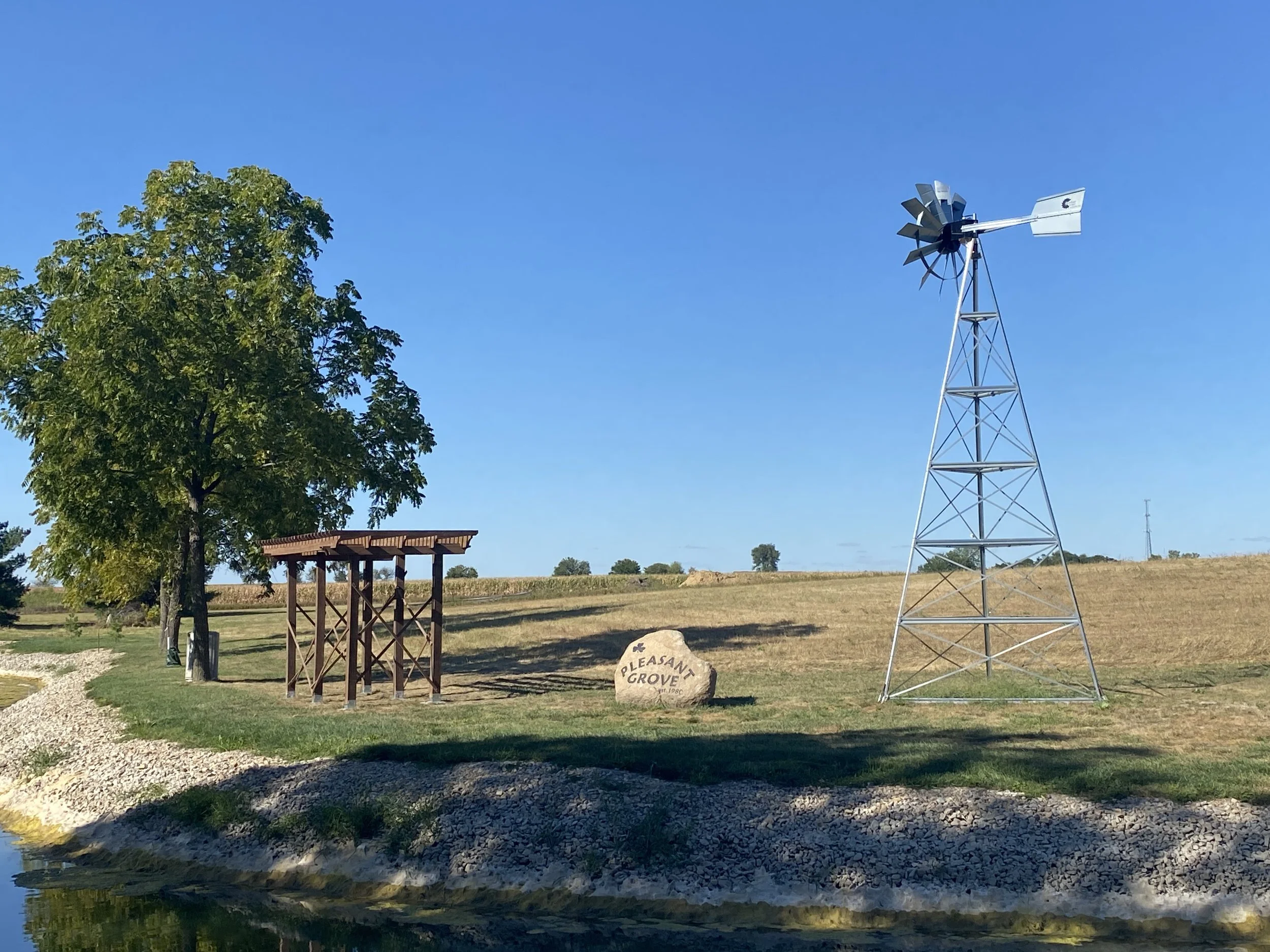 Pleasant Grove Heritage Park with pergola, engraved rock and windmill