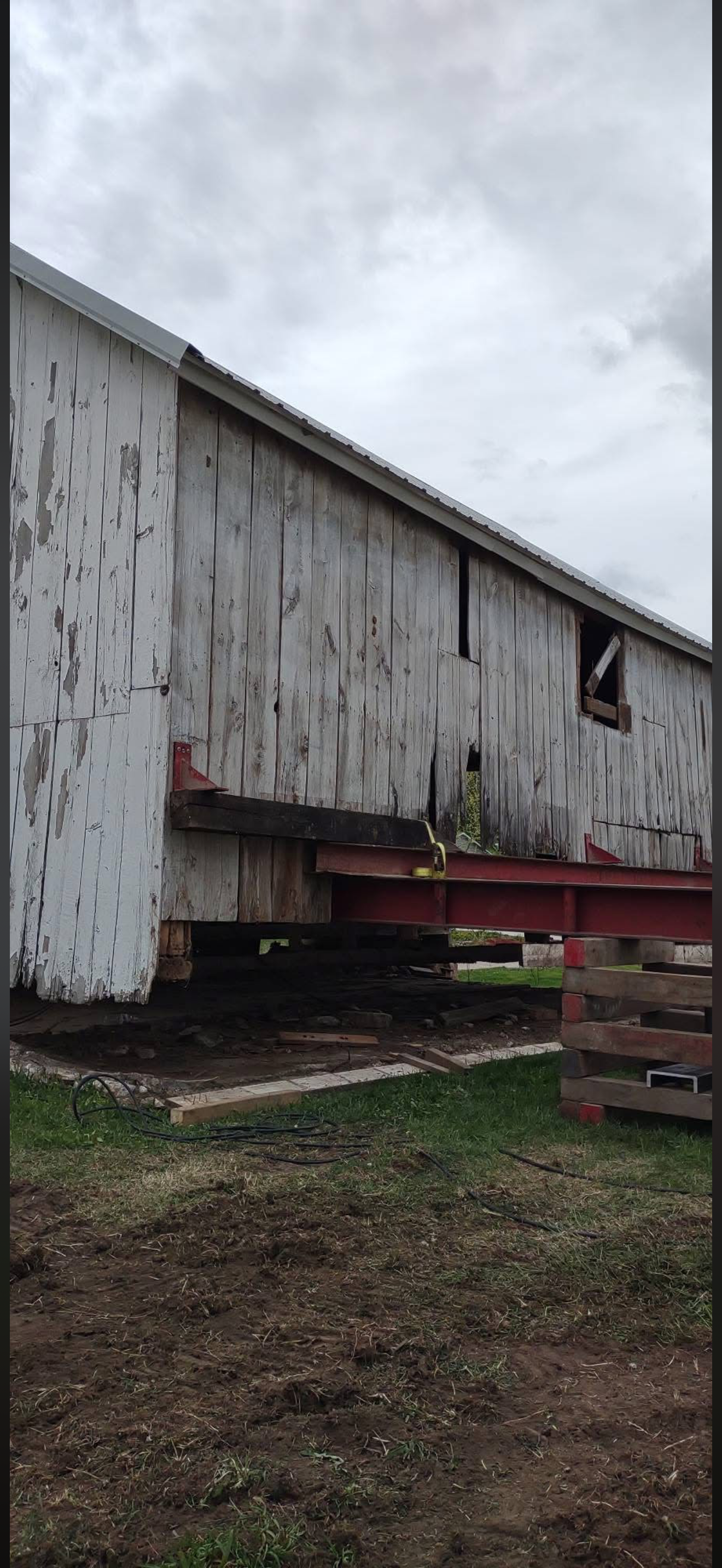 5/5/2026 Meyers Farmstead Historic District corn crib/hog barn starting restoration with lifting the barn to allow for restoration work on the foundation.
