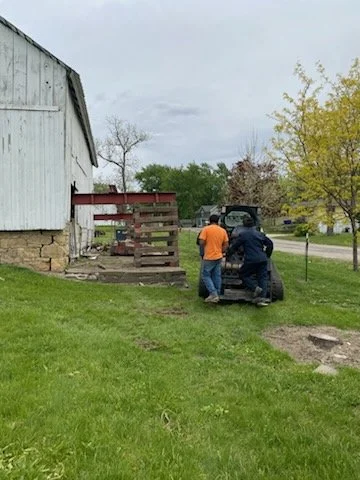 5/5/2026 Meyers Farmstead Historic District corn crib/hog barn starting restoration with lifting the barn to allow for restoration work on the foundation.