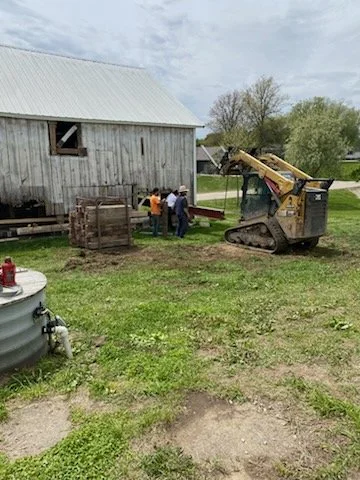 5/5/2026 Meyers Farmstead Historic District corn crib/hog barn starting restoration with lifting the barn to allow for restoration work on the foundation.