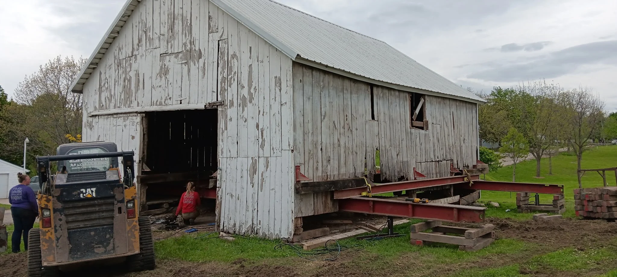 5/5/2026 Meyers Farmstead Historic District corn crib/hog barn starting restoration with lifting the barn to allow for restoration work on the foundation.