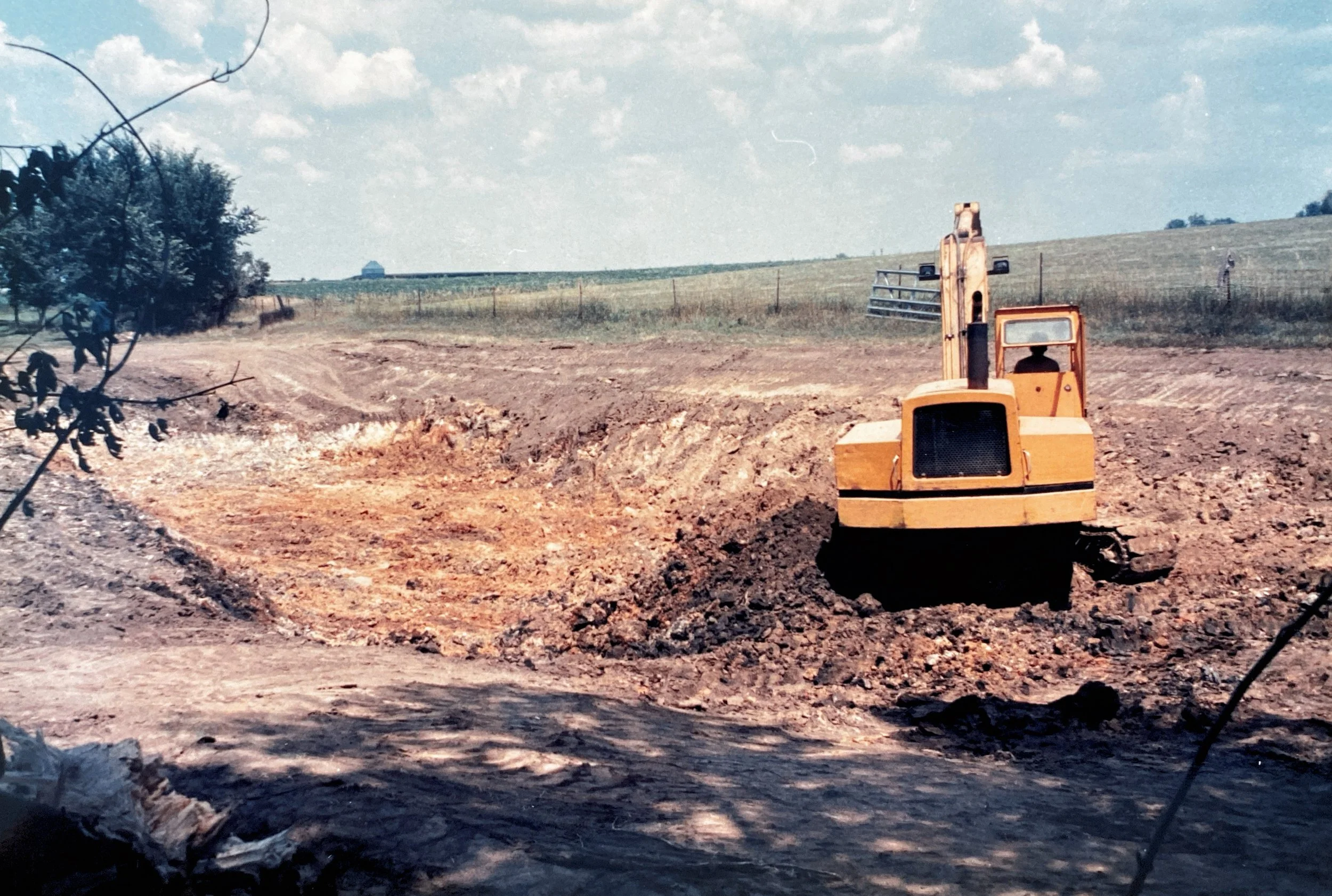 August 10, 1989 - work begins on digging the first pond for the McElmeel family, which would eventually become the Pleasant Grove Heritage Park.