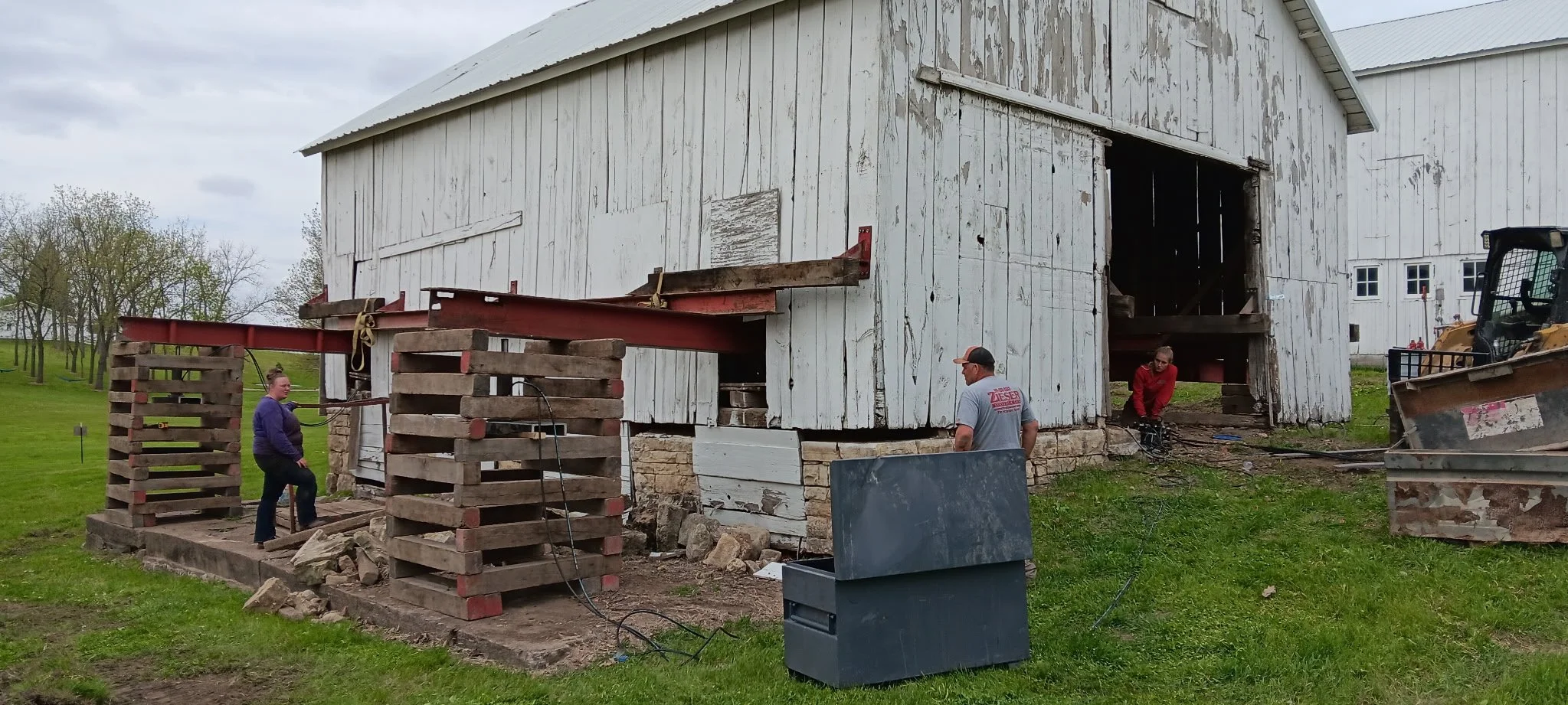 5/5/2026 Meyers Farmstead Historic District corn crib/hog barn starting restoration with lifting the barn to allow for restoration work on the foundation.